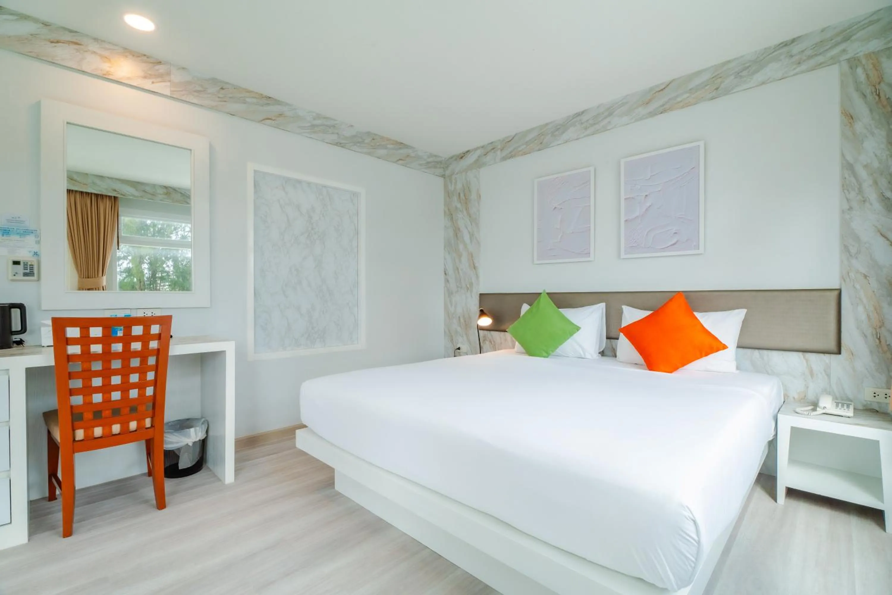 Bed in Baumancasa Beach Resort