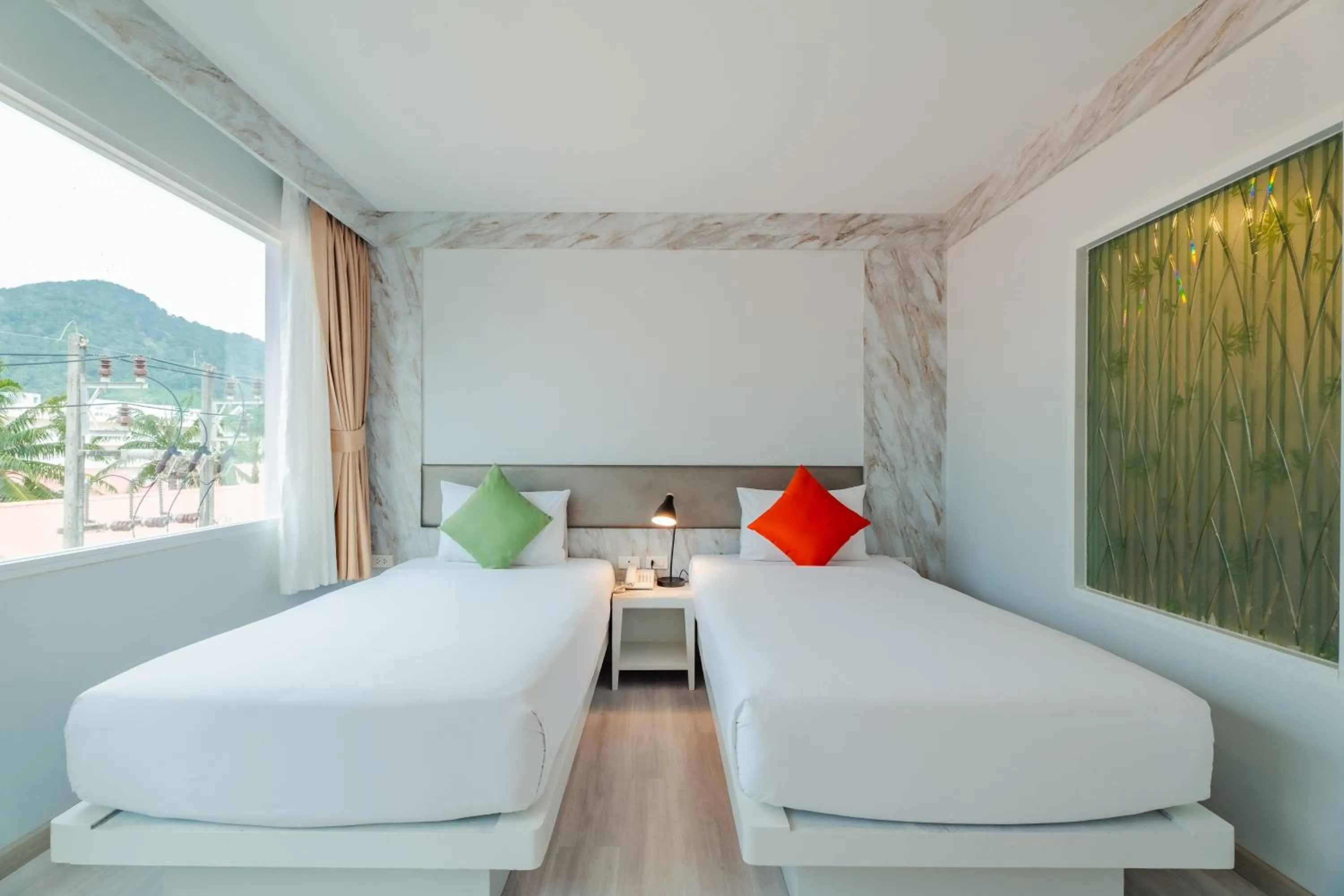 Bed in Baumancasa Beach Resort