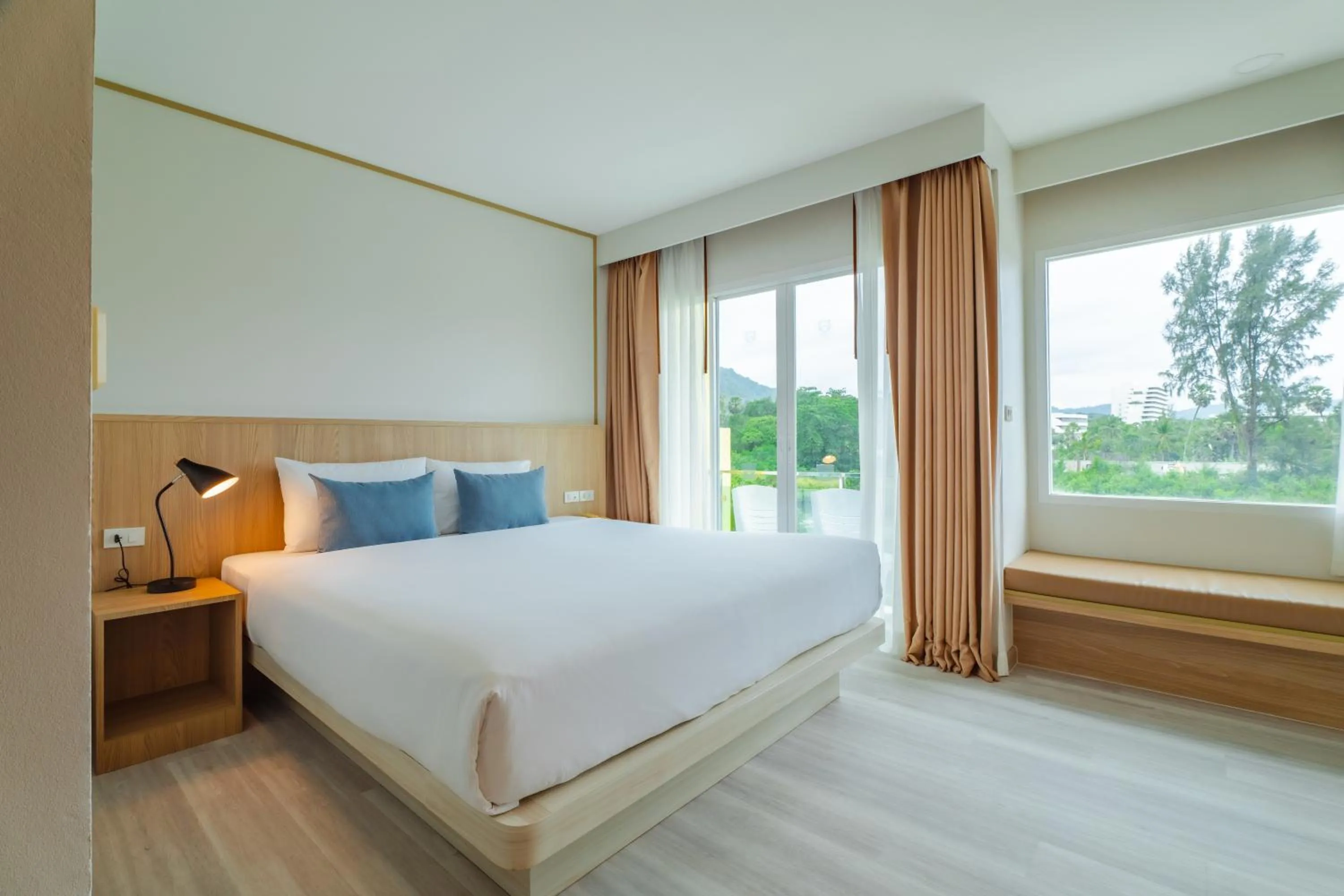 Bed in Baumancasa Beach Resort