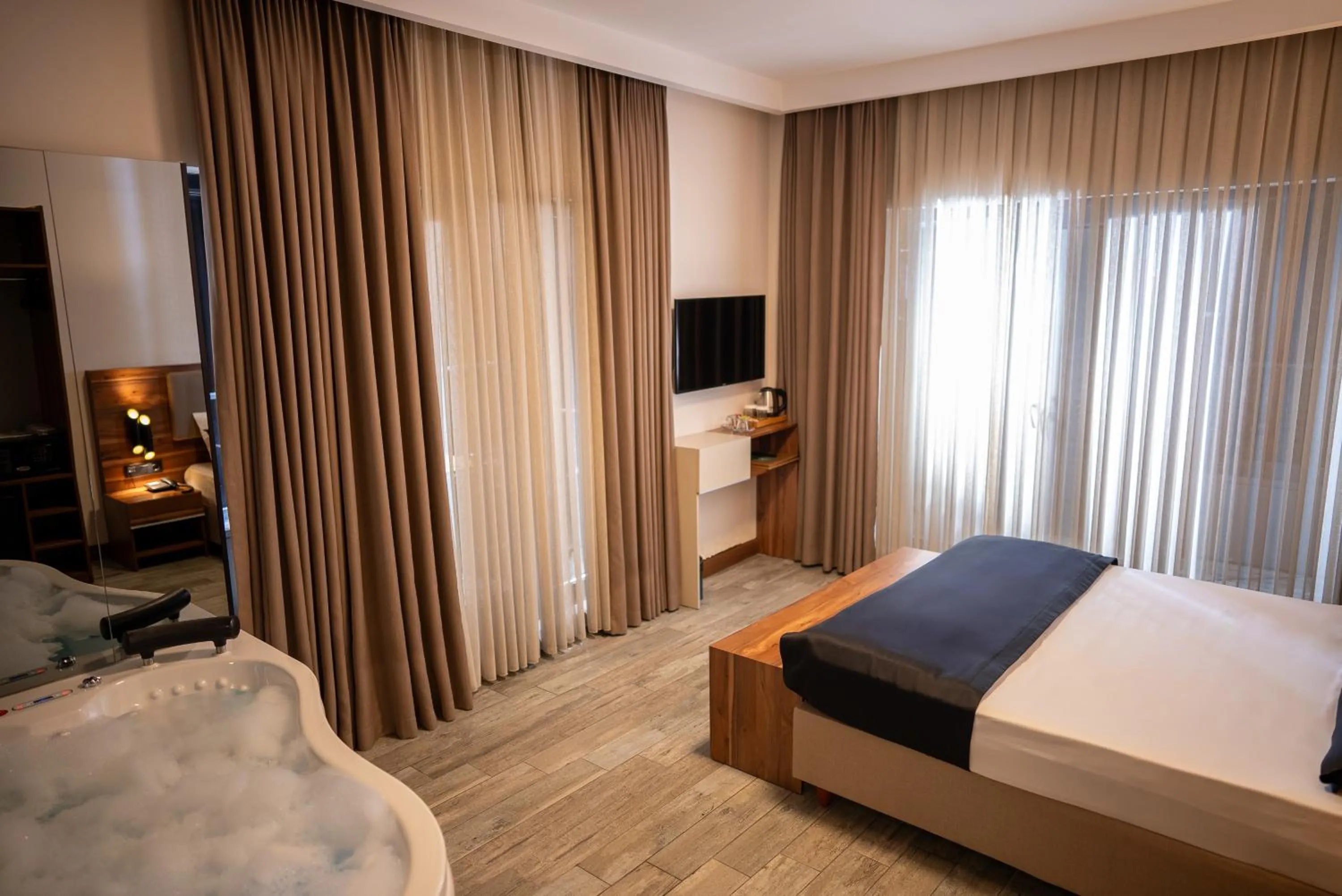 Bed in Mari Suites Hotel