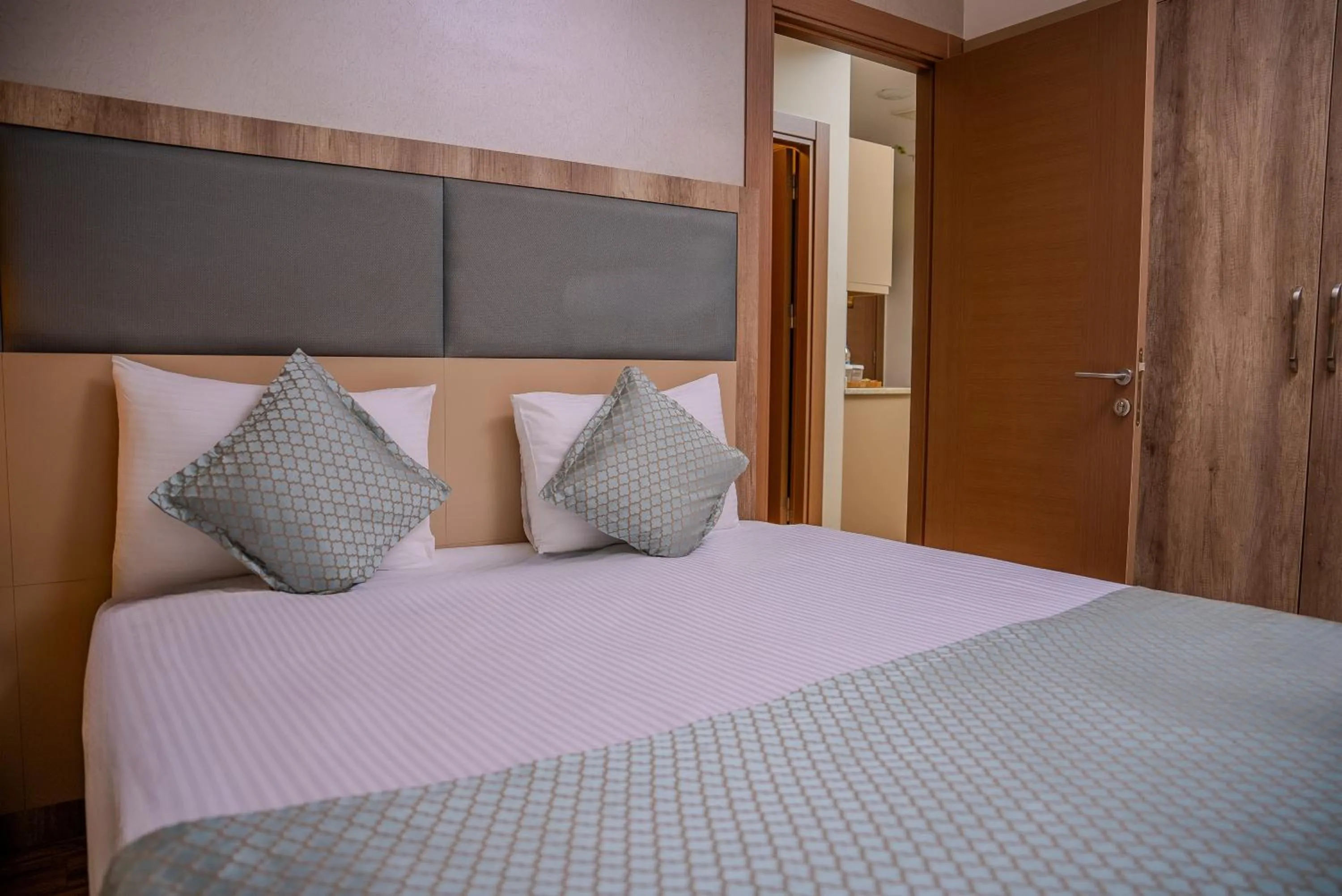 Bed in Mari Suites Hotel