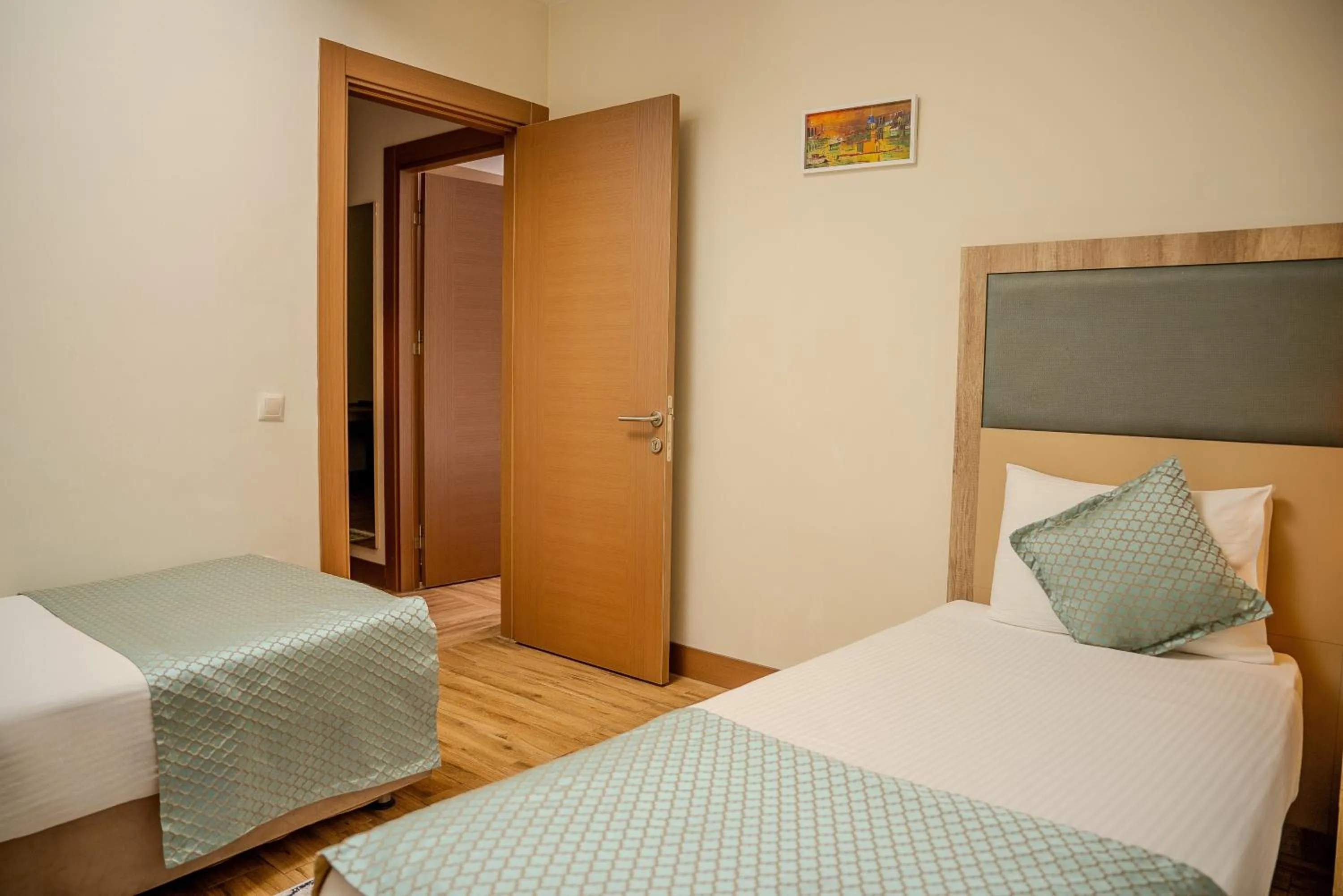 Bed in Mari Suites Hotel