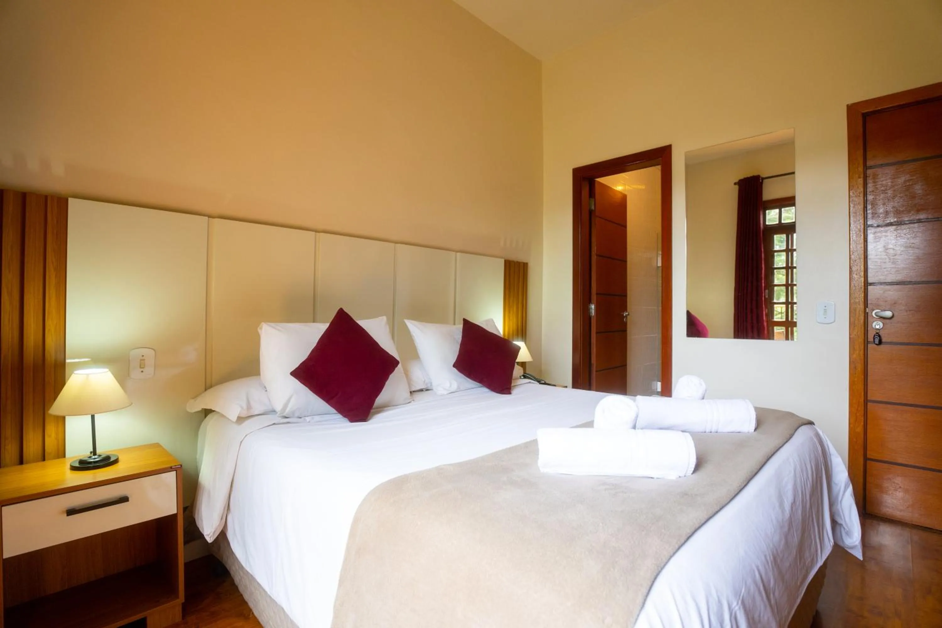 Bed in Pousada La Toscana Campos do Jordão