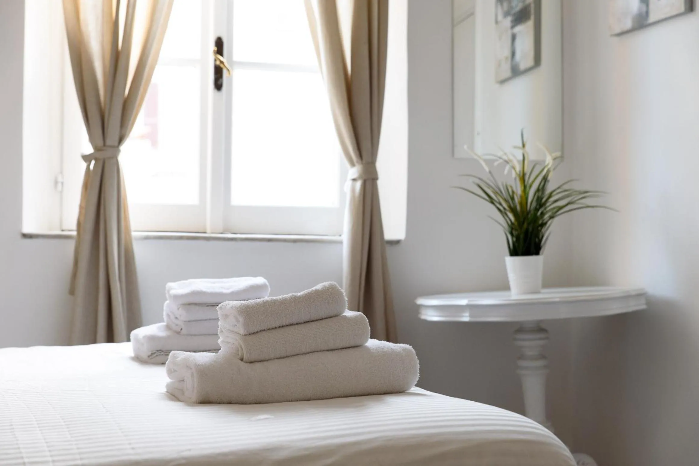 Bed in White terrace apartment navona
