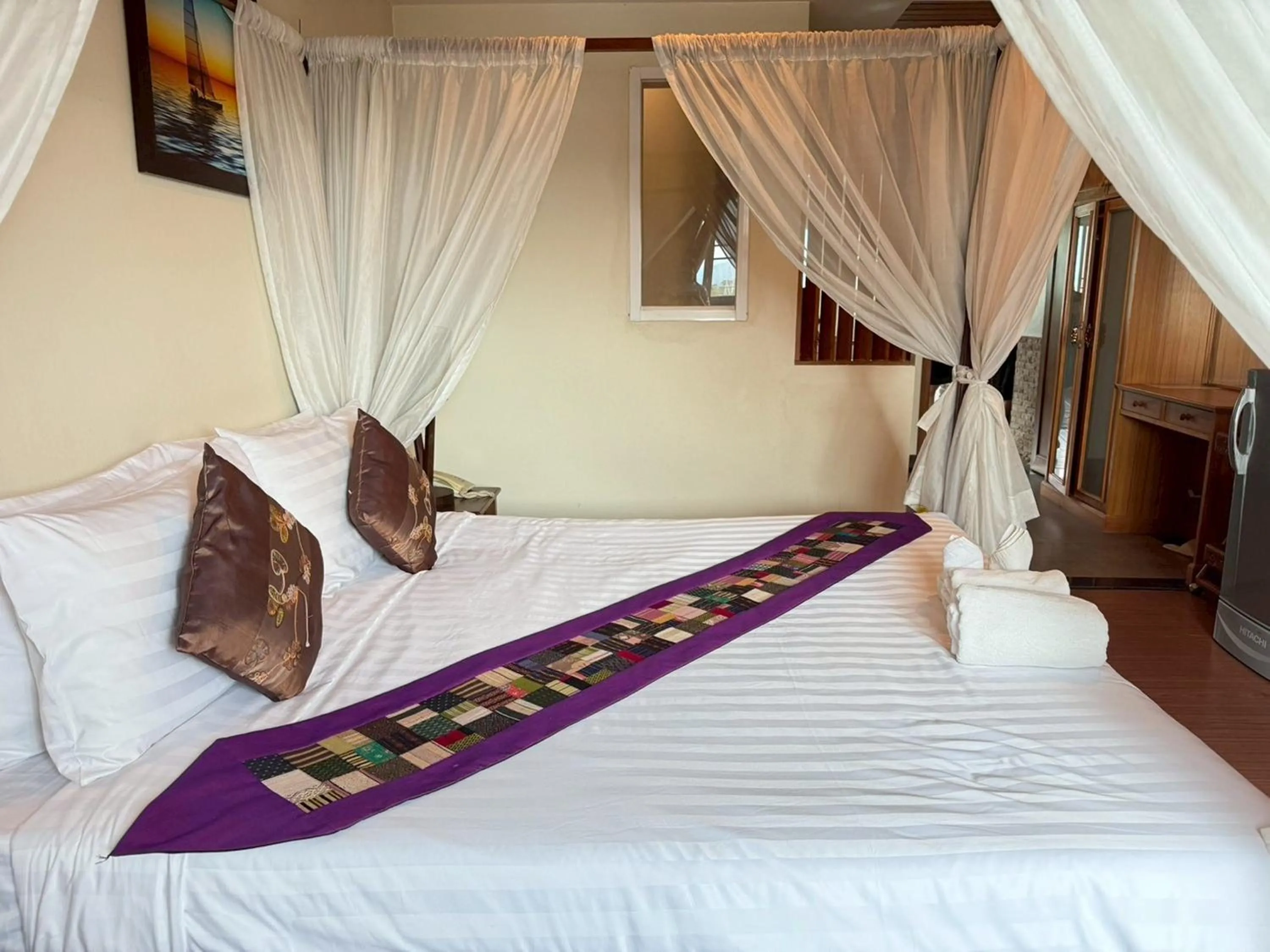 Photo of the whole room, Bed in Maekhong Delta Boutique Hotel