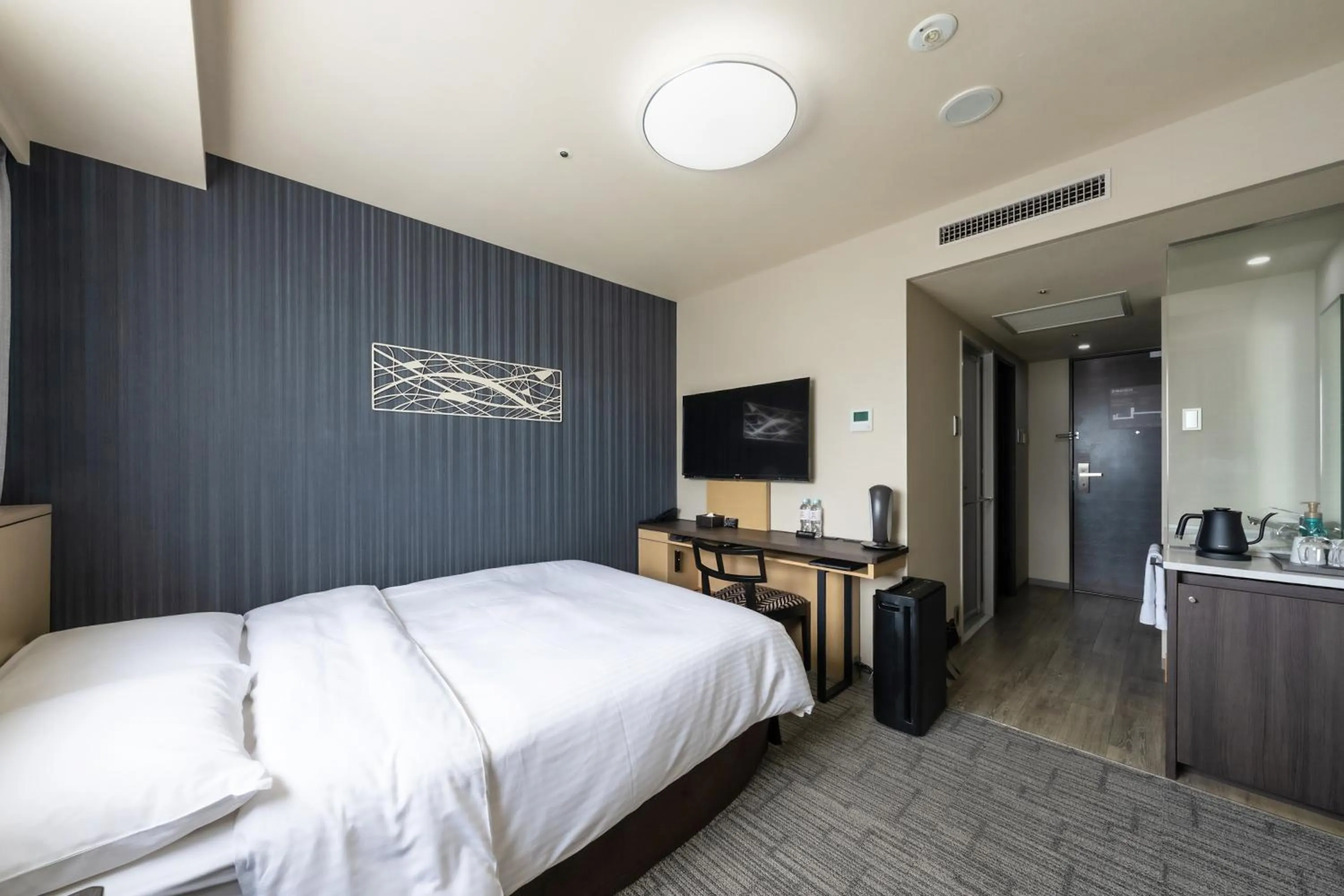 Bed in Richmond Hotel Yokohama Ekimae