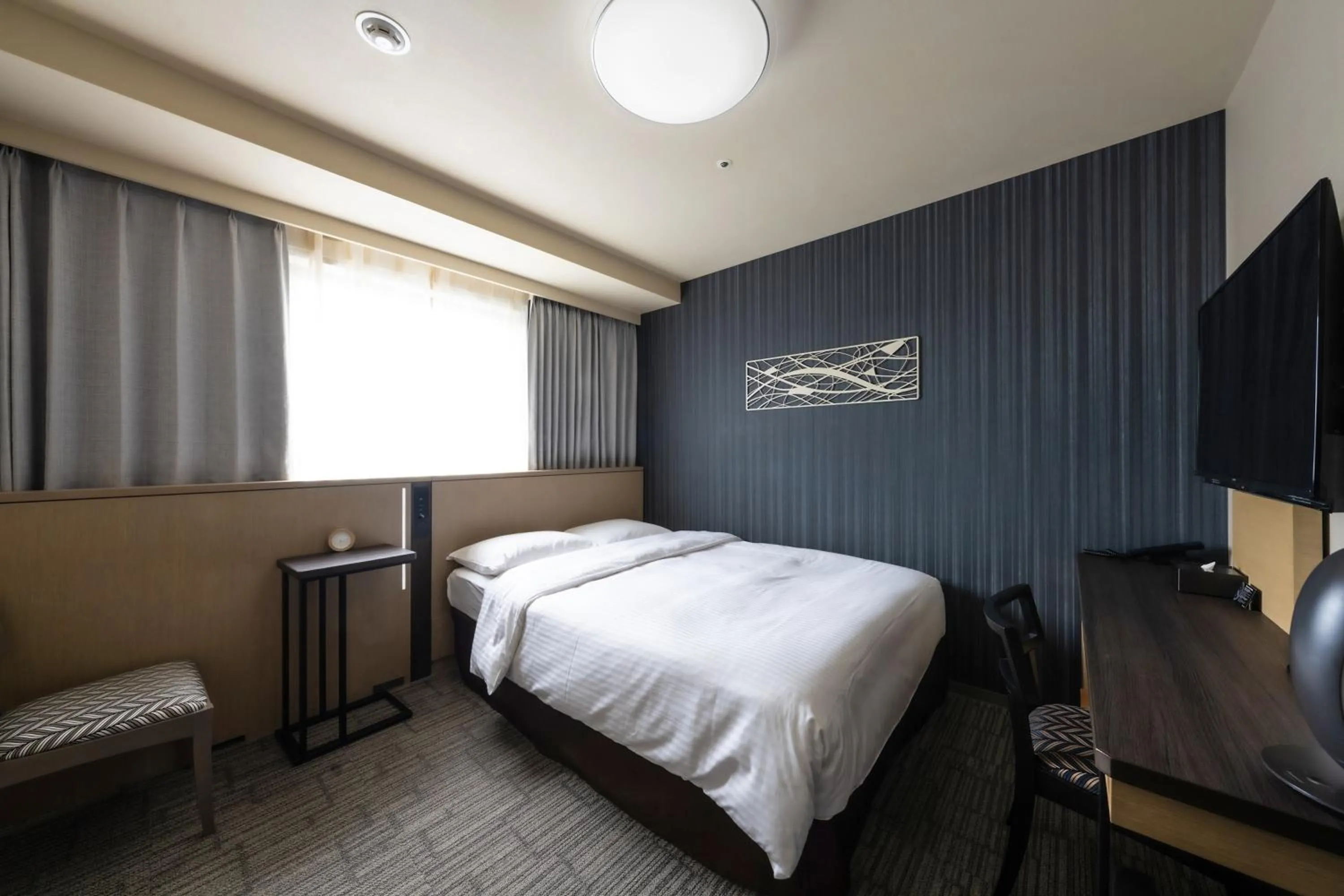 Bed in Richmond Hotel Yokohama Ekimae