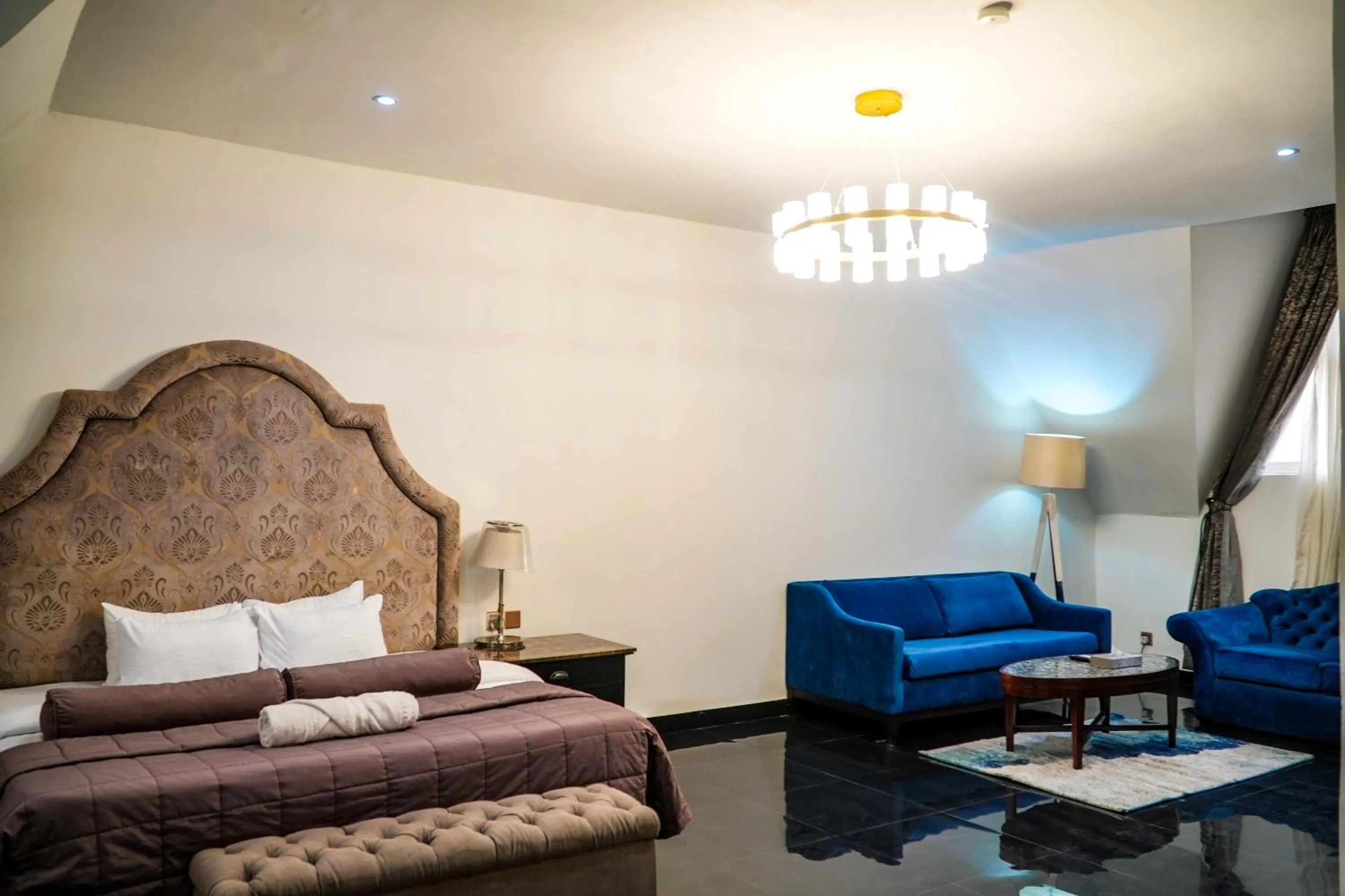 Living room, Bed in Amor Hotels Abuja