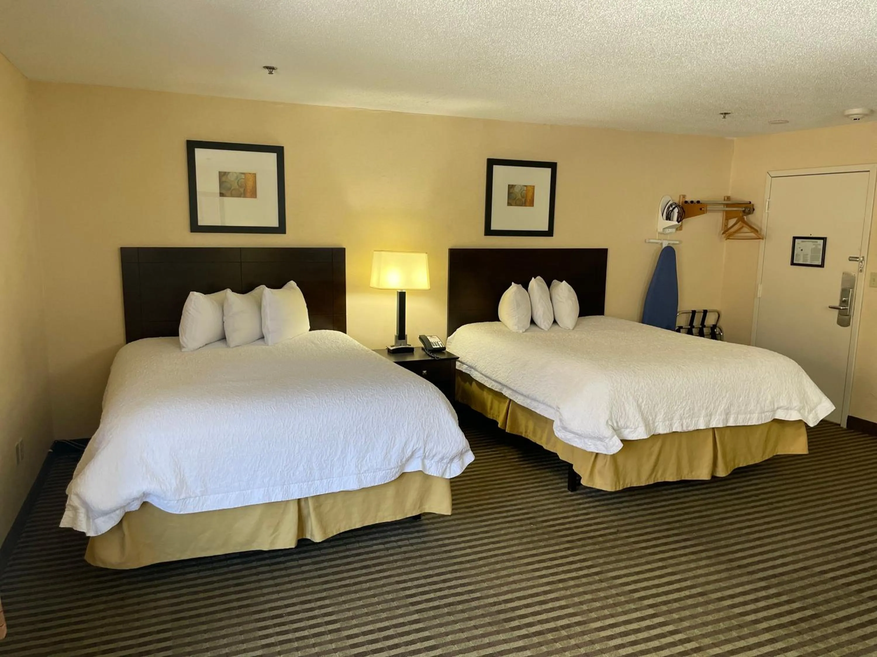 Bed in Whitney Inn & Suites