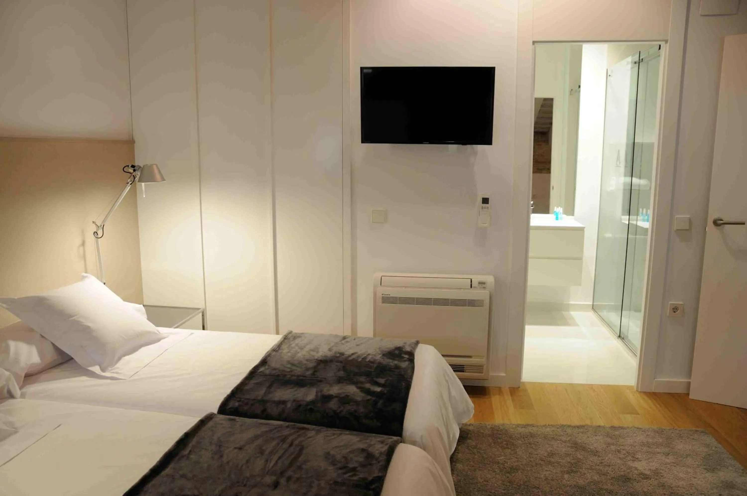 Bed in Mon Suites San Martin