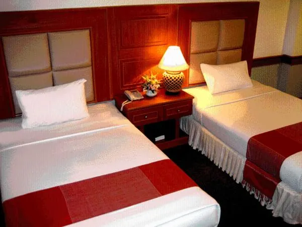 Bed in Raya Grand Hotel