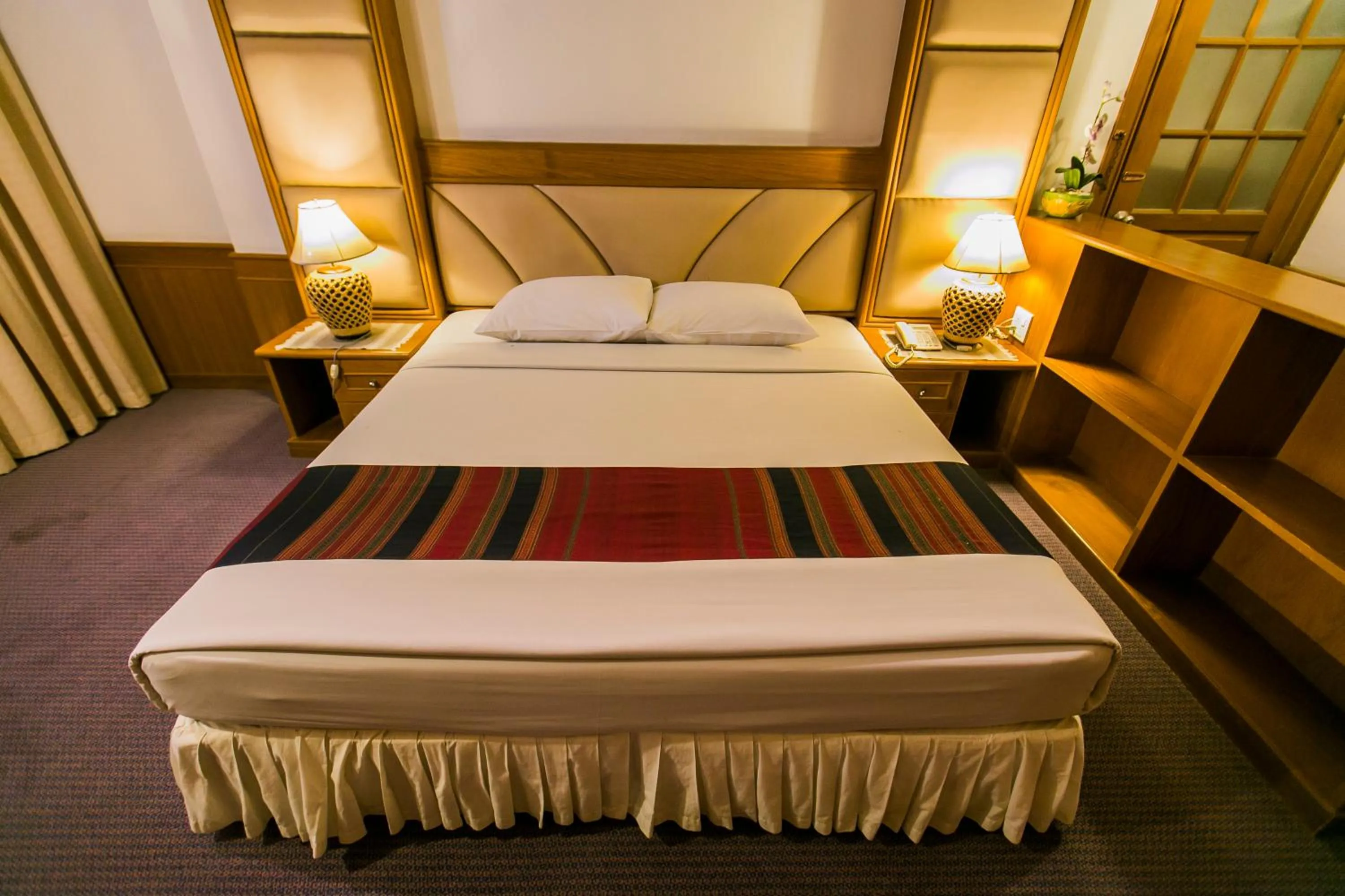 Bed in Raya Grand Hotel