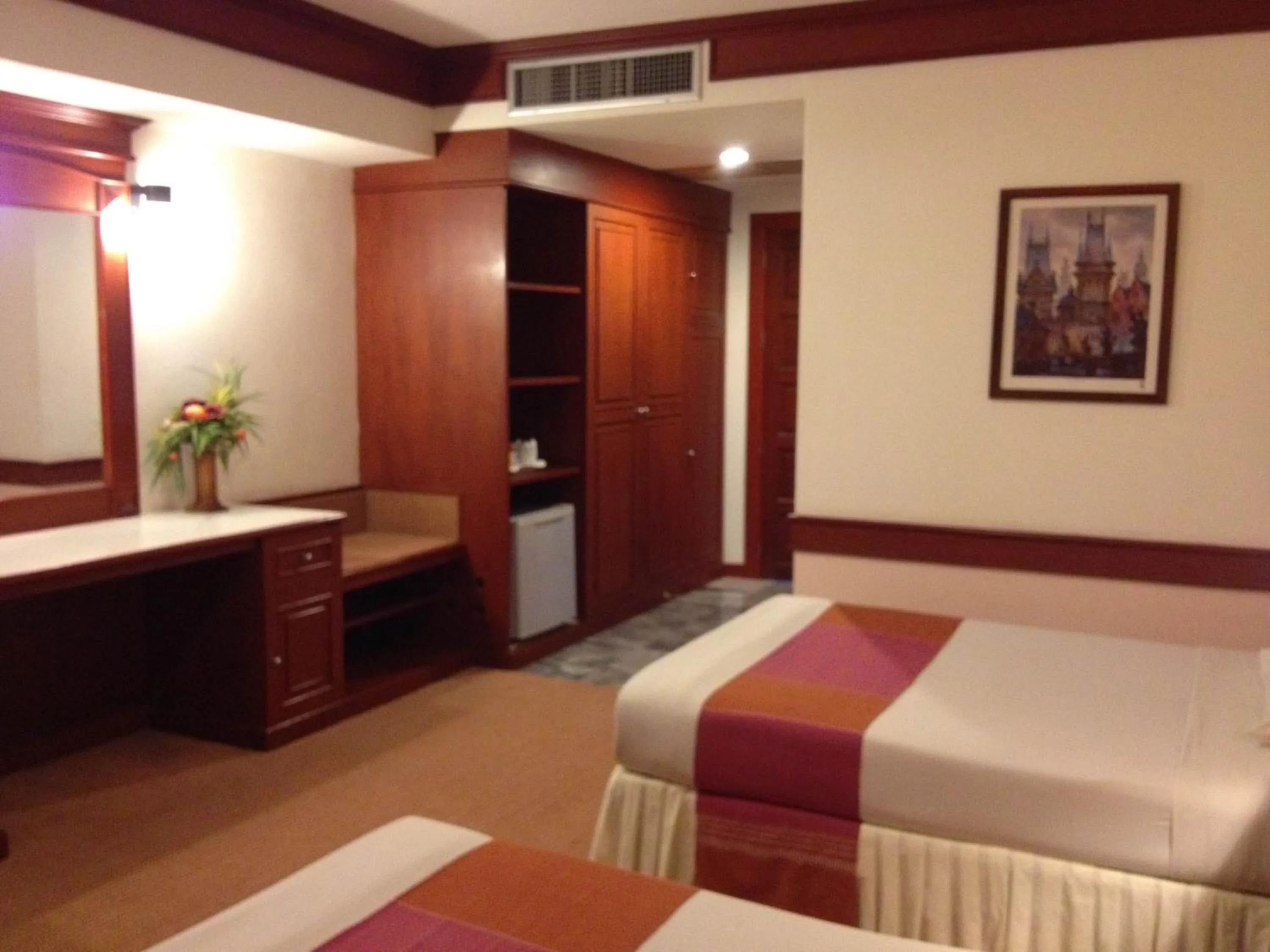 Bed in Raya Grand Hotel