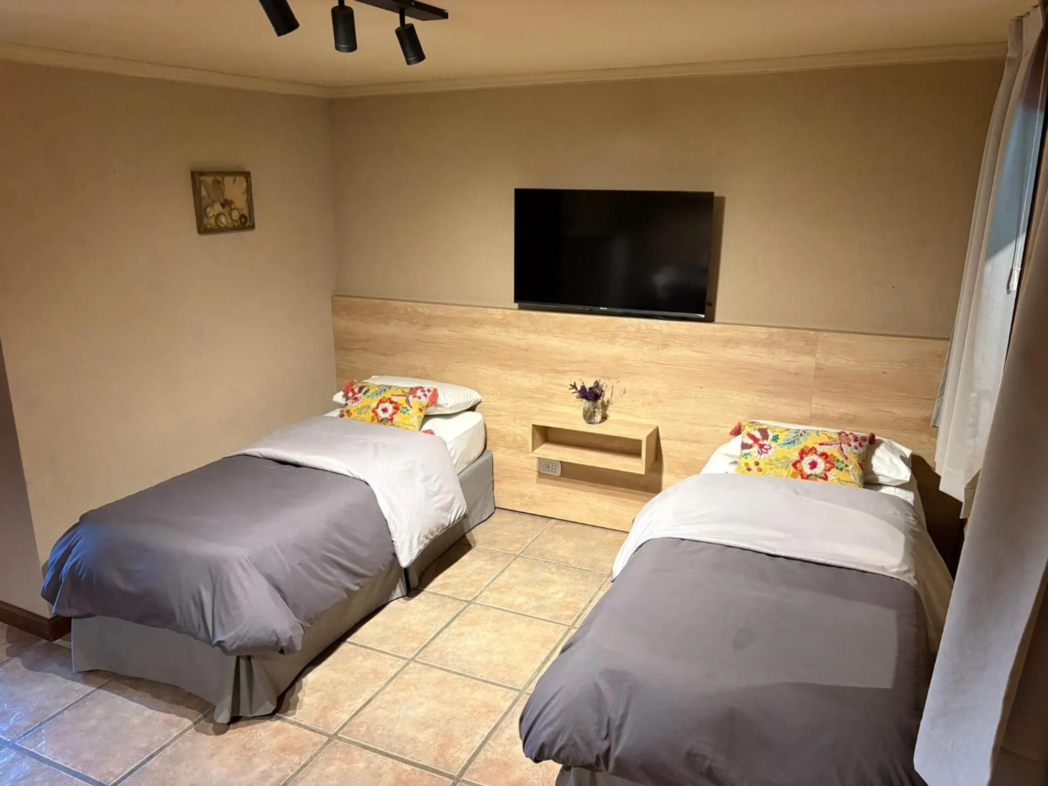 Bed in Le Bouquet Apart Hotel