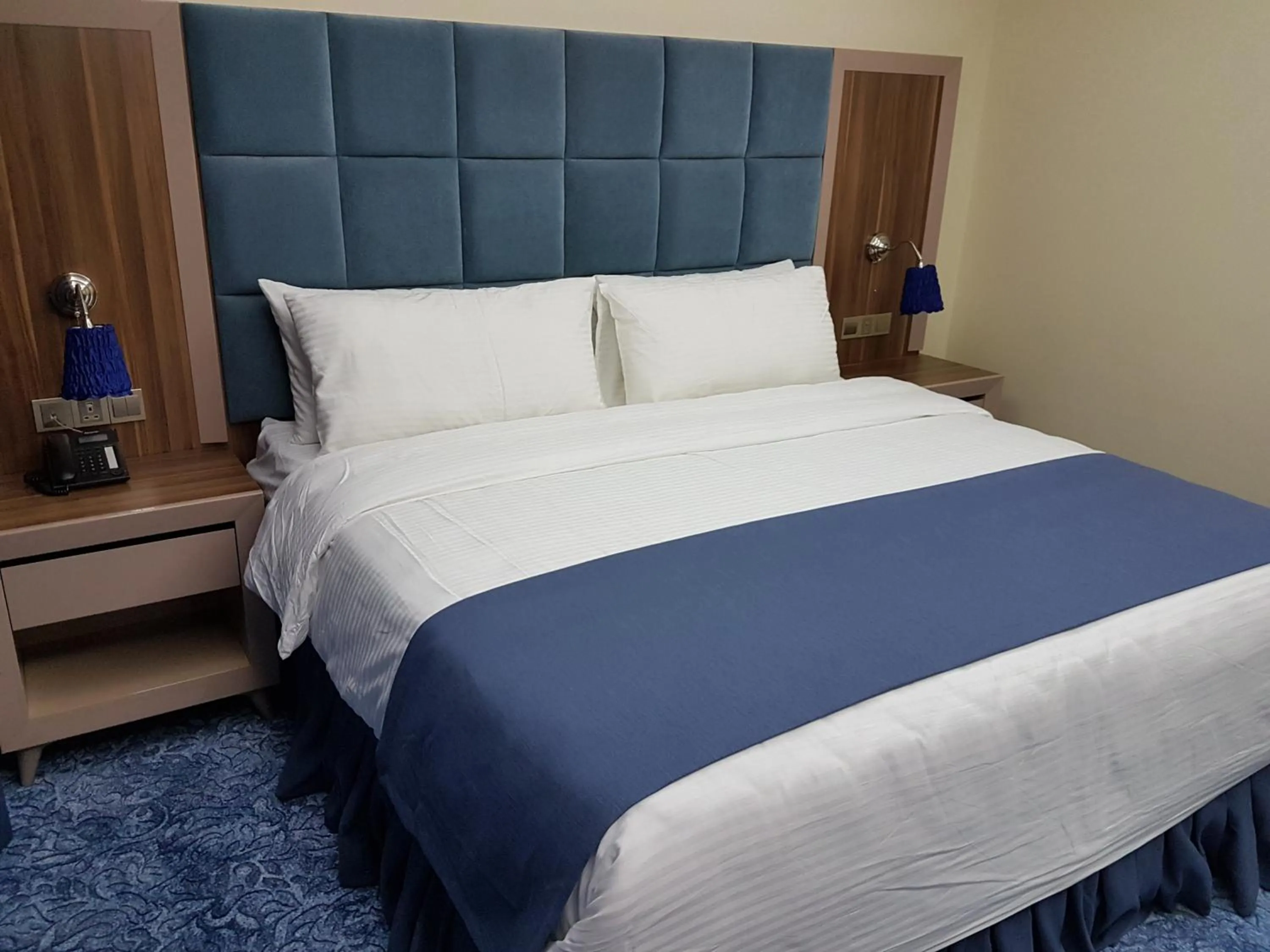 Bed in Swiss Blue serviced Apartments- Al Zahra