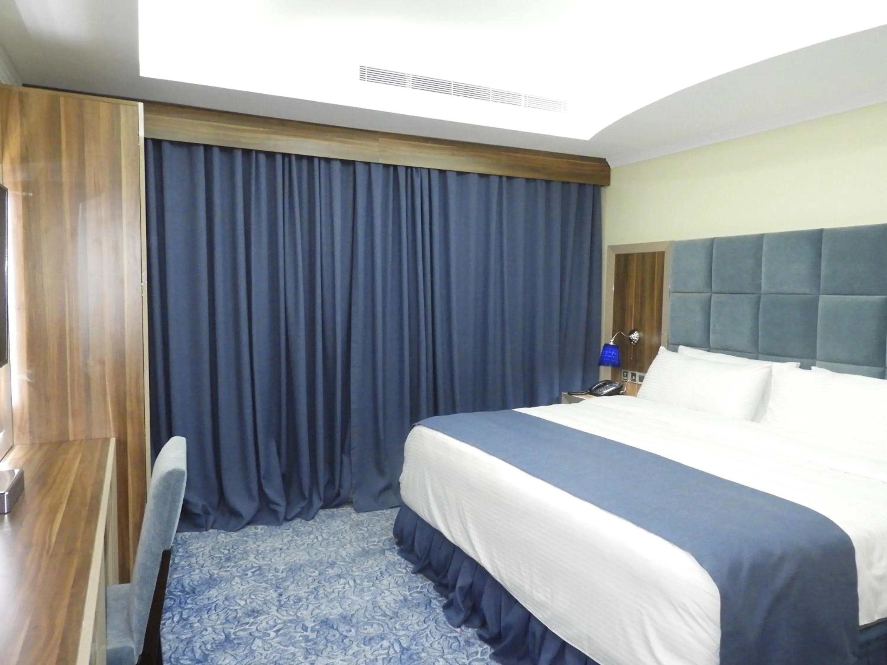 Bed in Swiss Blue serviced Apartments- Al Zahra