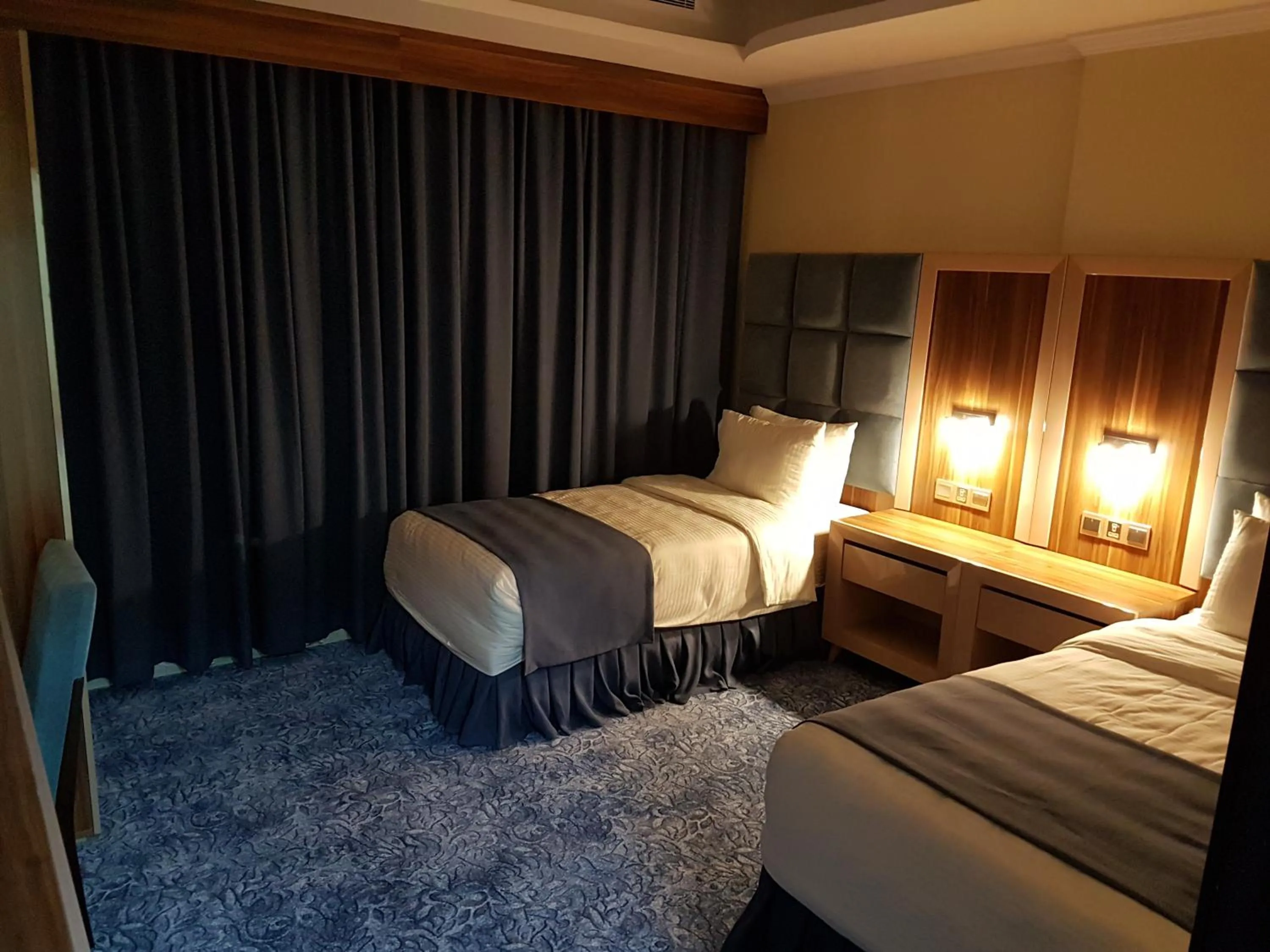 Bed in Swiss Blue serviced Apartments- Al Zahra