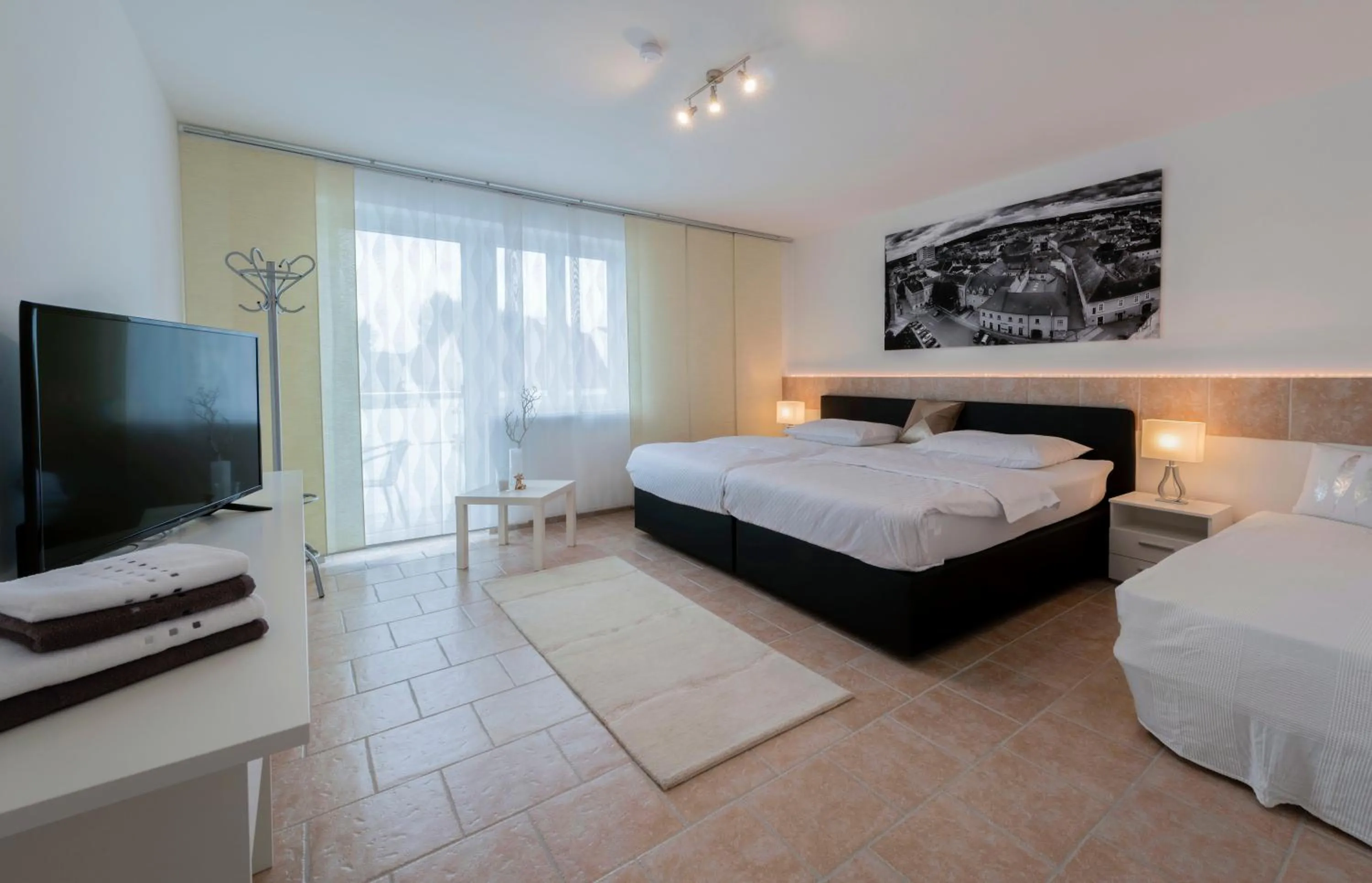 Deluxe Triple Room with Balcony - single occupancy in WN Rooms