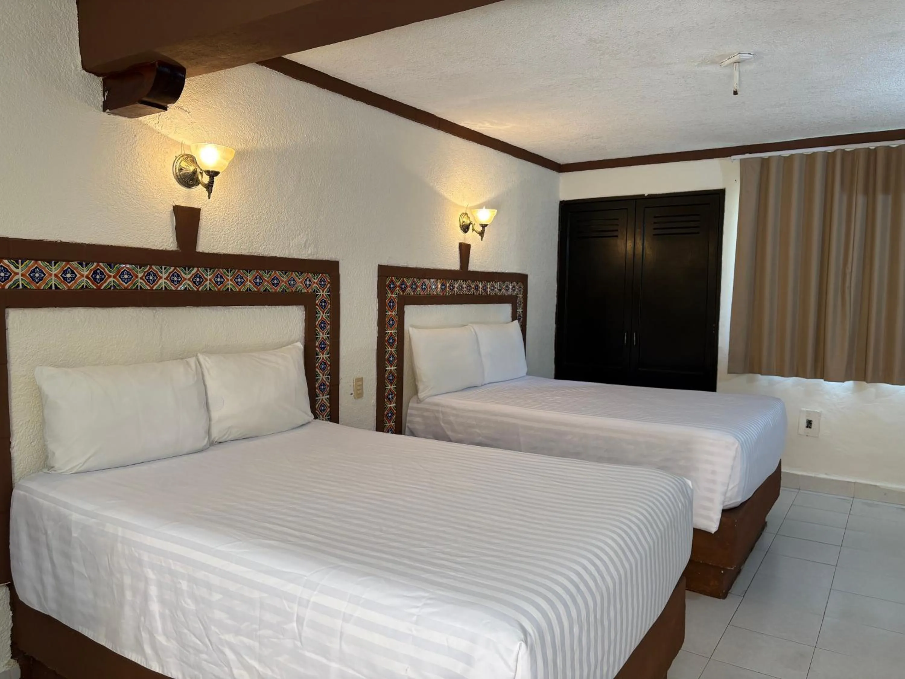 Bed in Suites Cancun Center