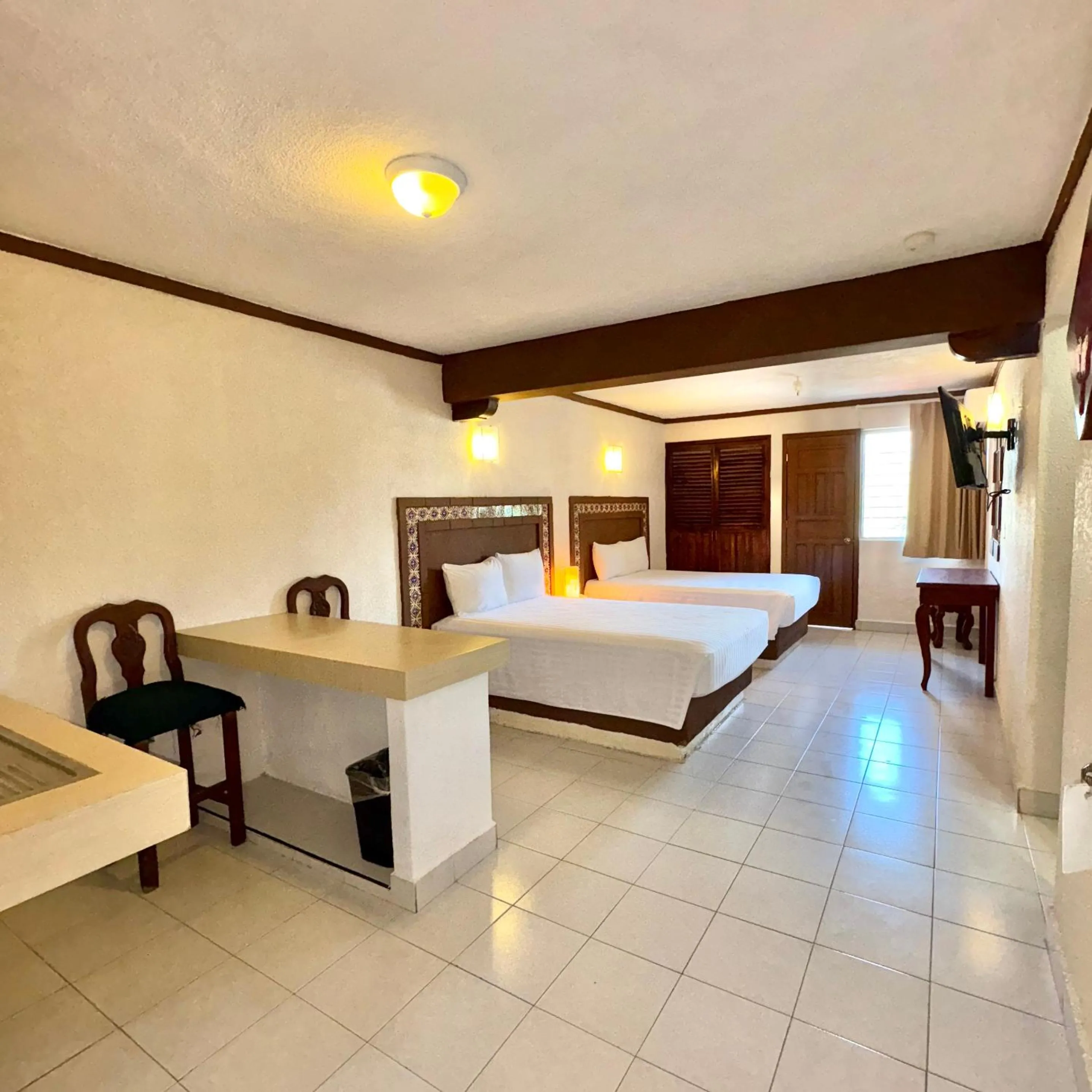 Bed in Suites Cancun Center