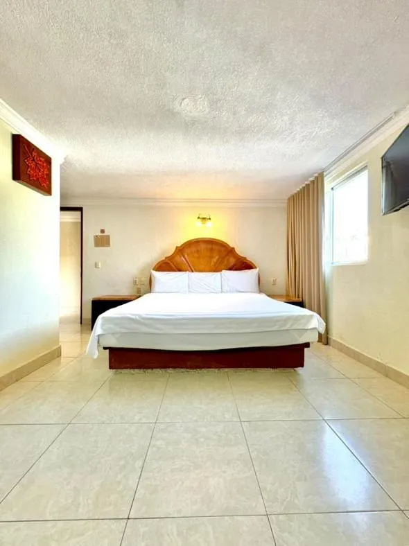 Bed in Suites Cancun Center