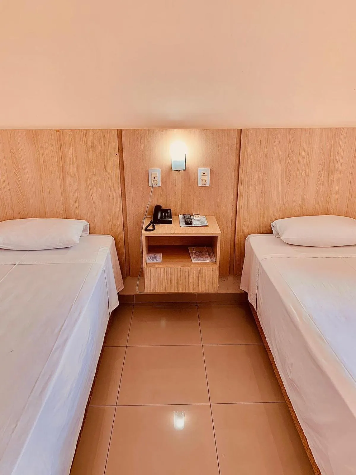 Bed in Victoria Plaza Hotel