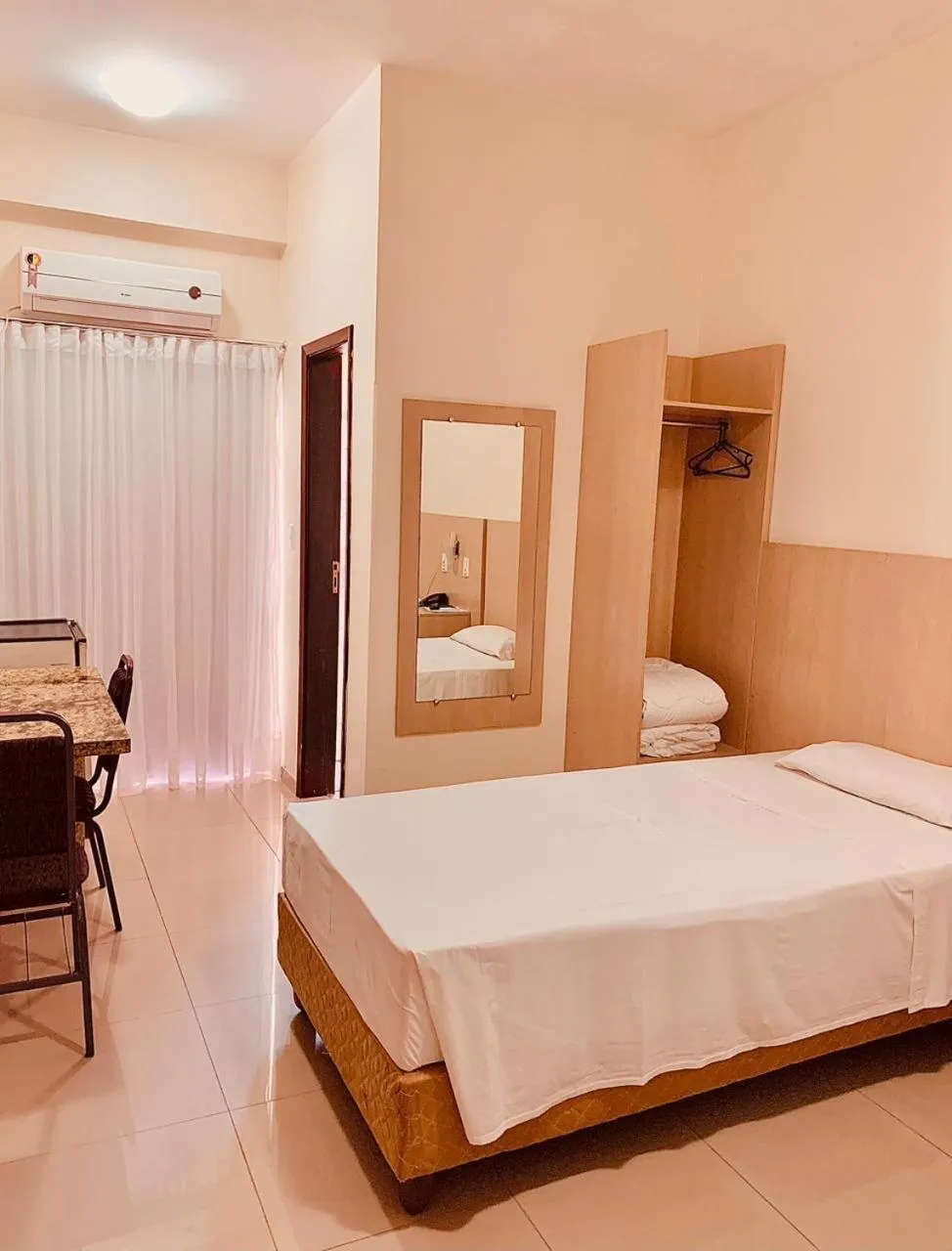 Bed in Victoria Plaza Hotel