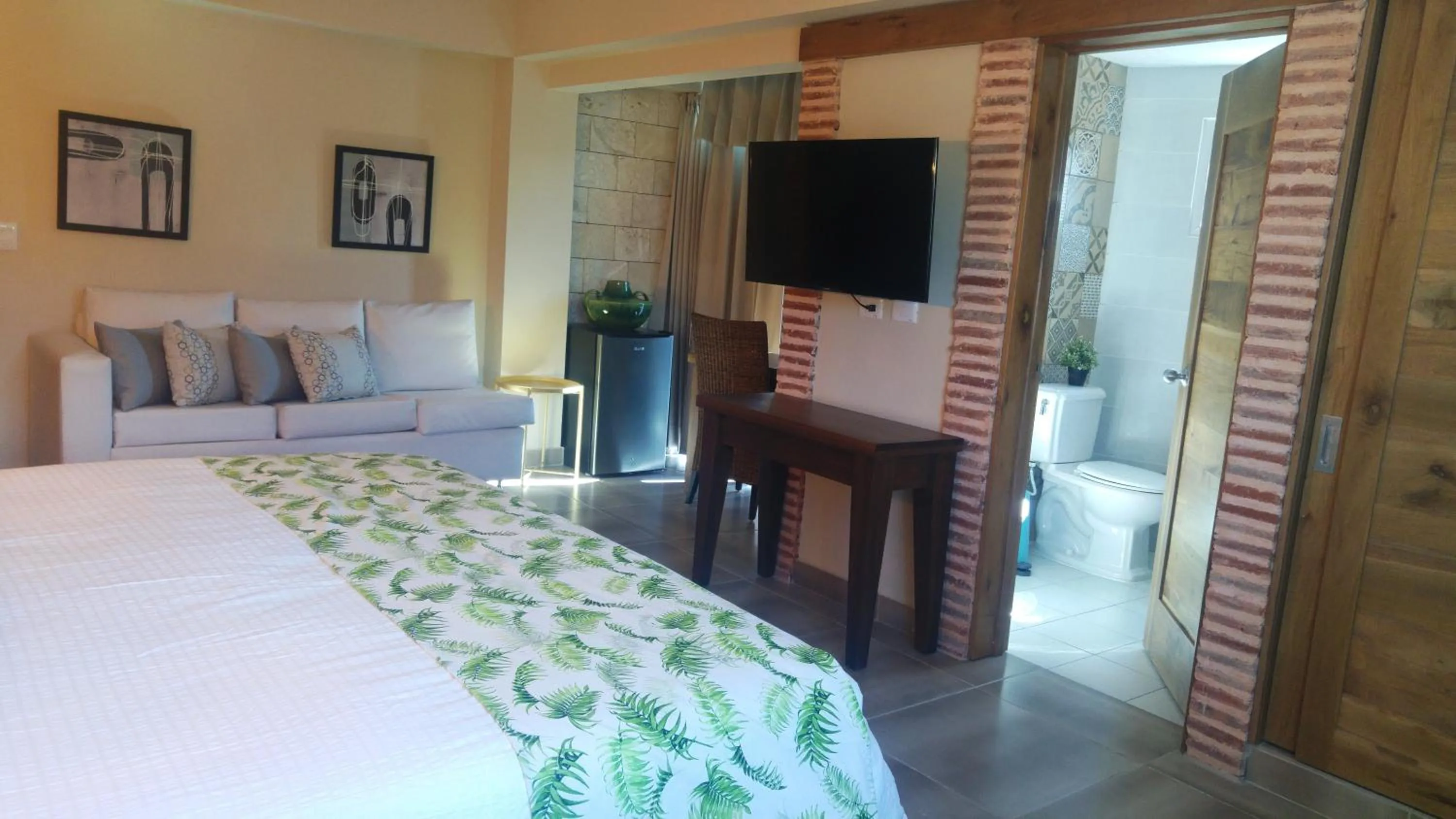 Seating area, Bed in MON Hotel Boutique