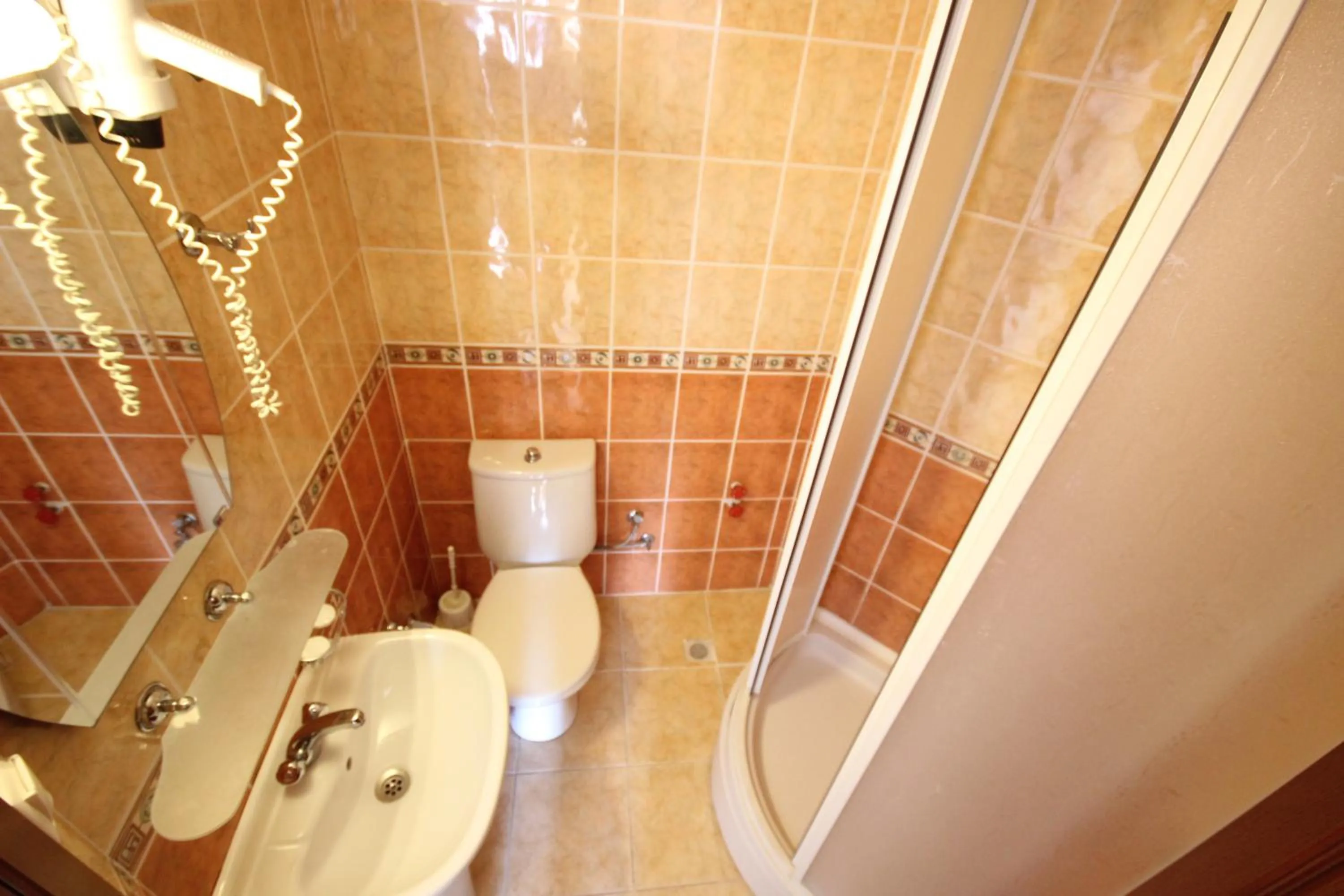 Toilet in Minta Apart Hotel