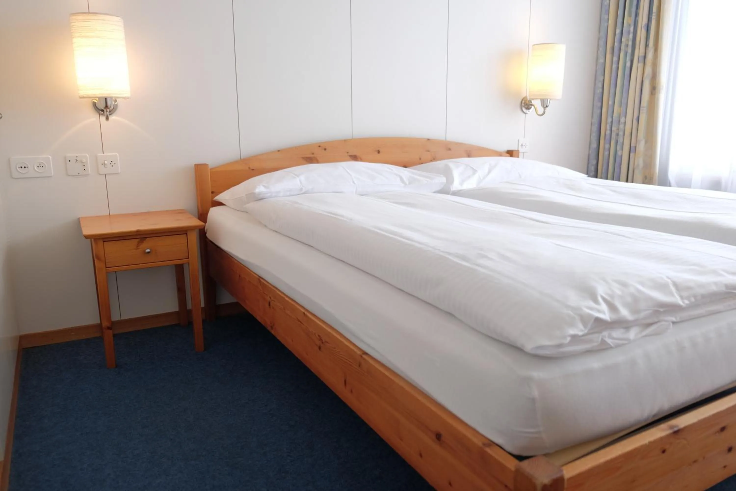 Bed in Guest Rooms with a great view at Residence Brunner