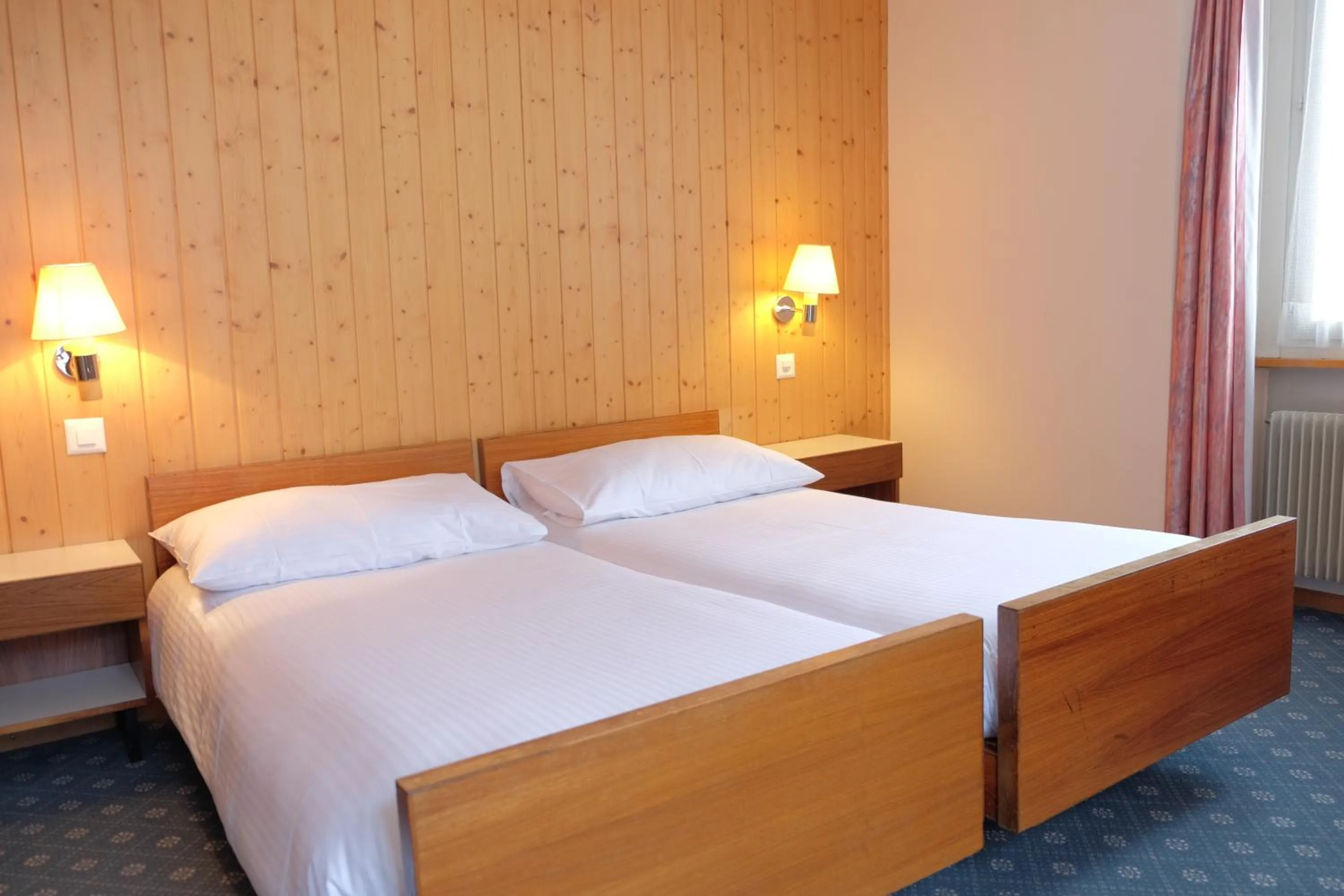 Bed in Guest Rooms with a great view at Residence Brunner
