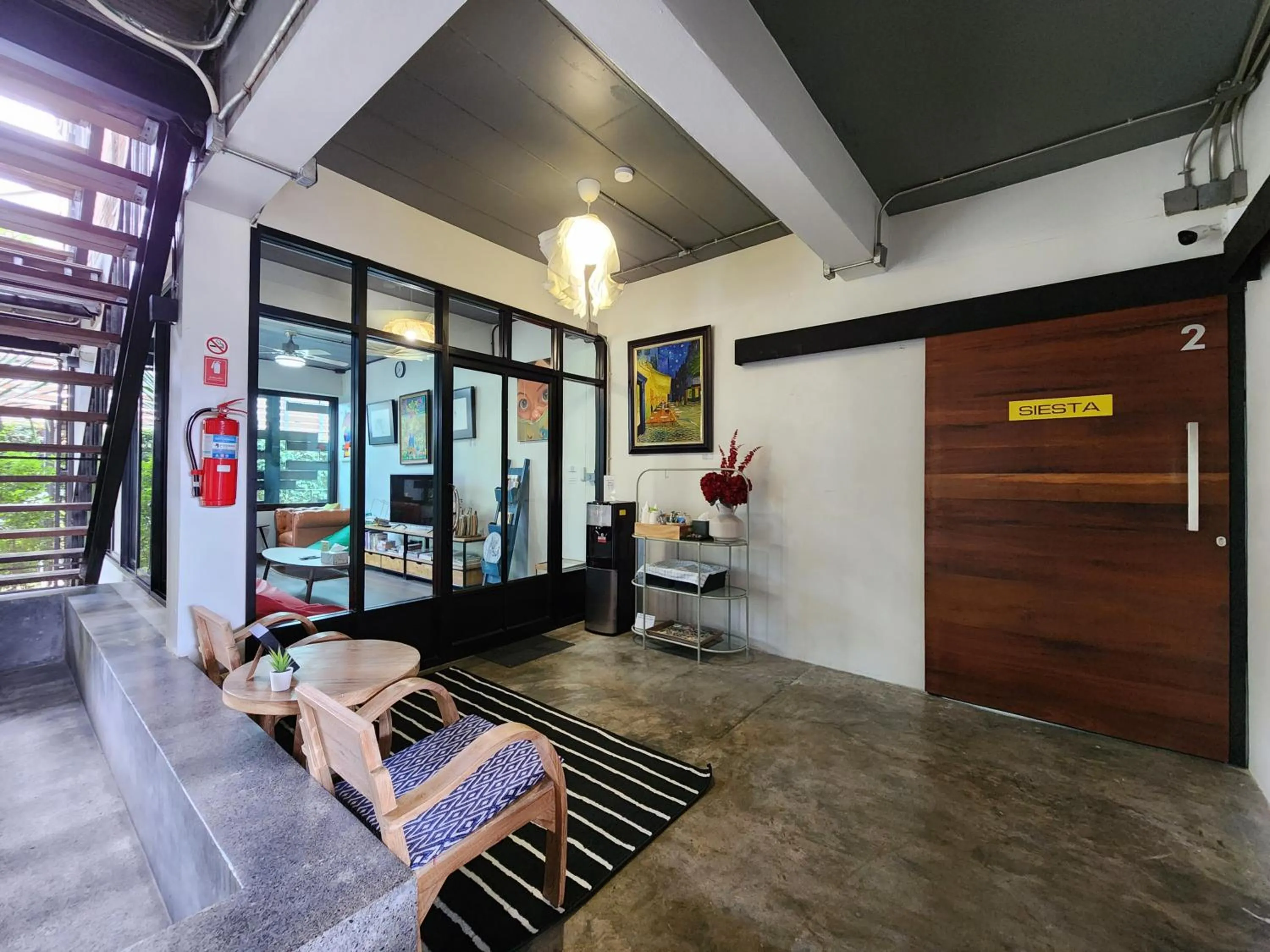 Communal lounge/ TV room in Baan Mai Kradan Hostel Chiang Rai