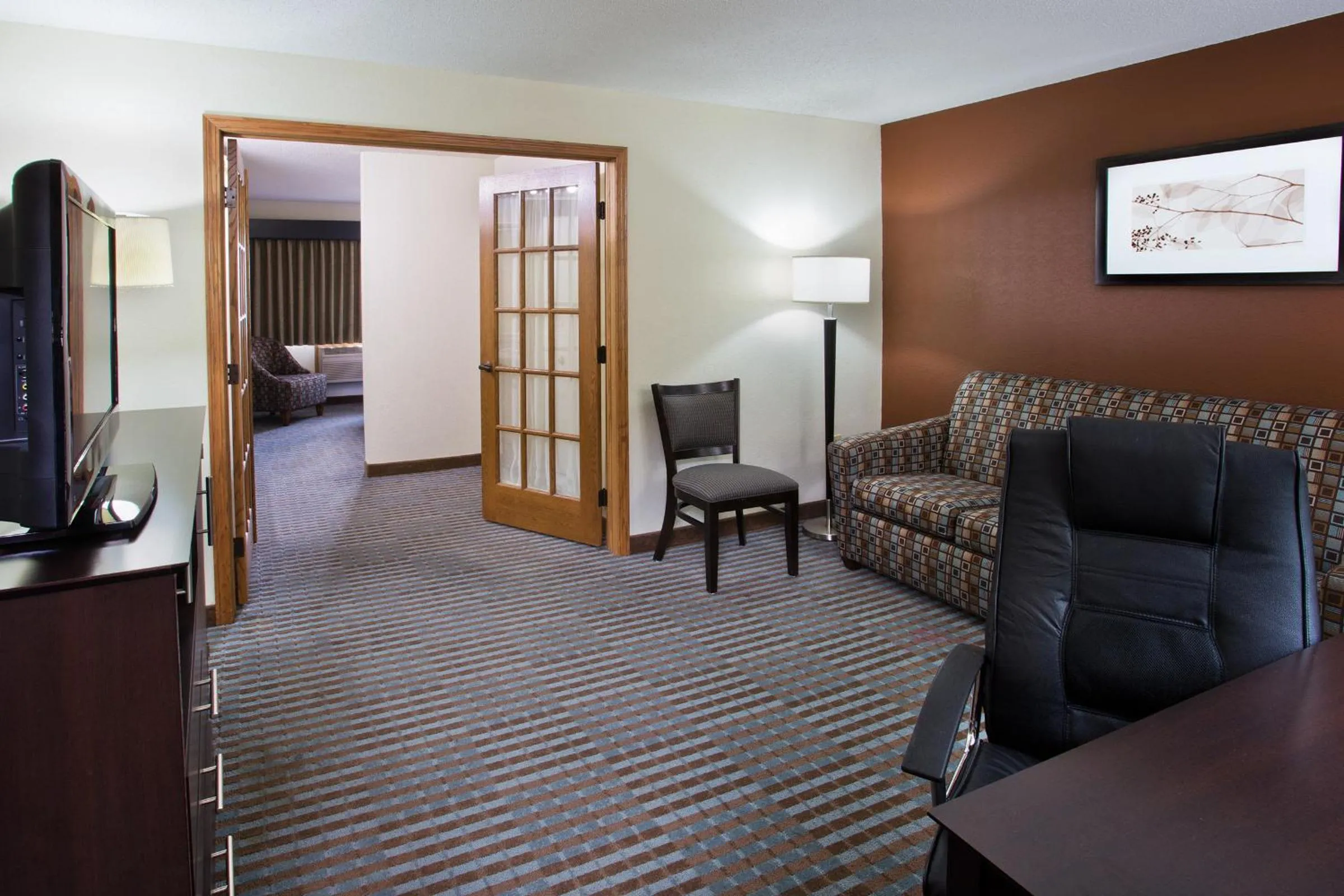 Living room in AmericInn by Wyndham Lincoln North