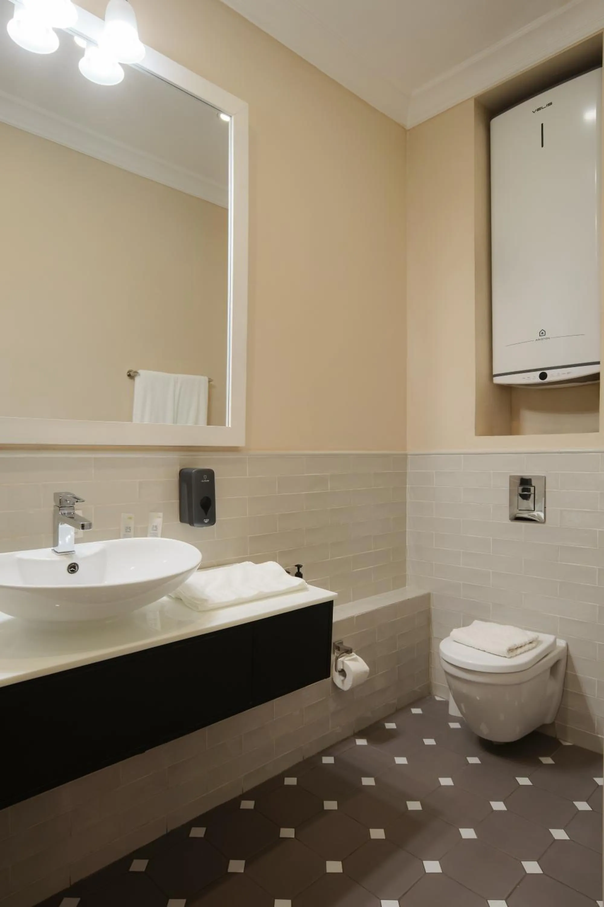 Toilet in Madison Ave Hotel Bishkek