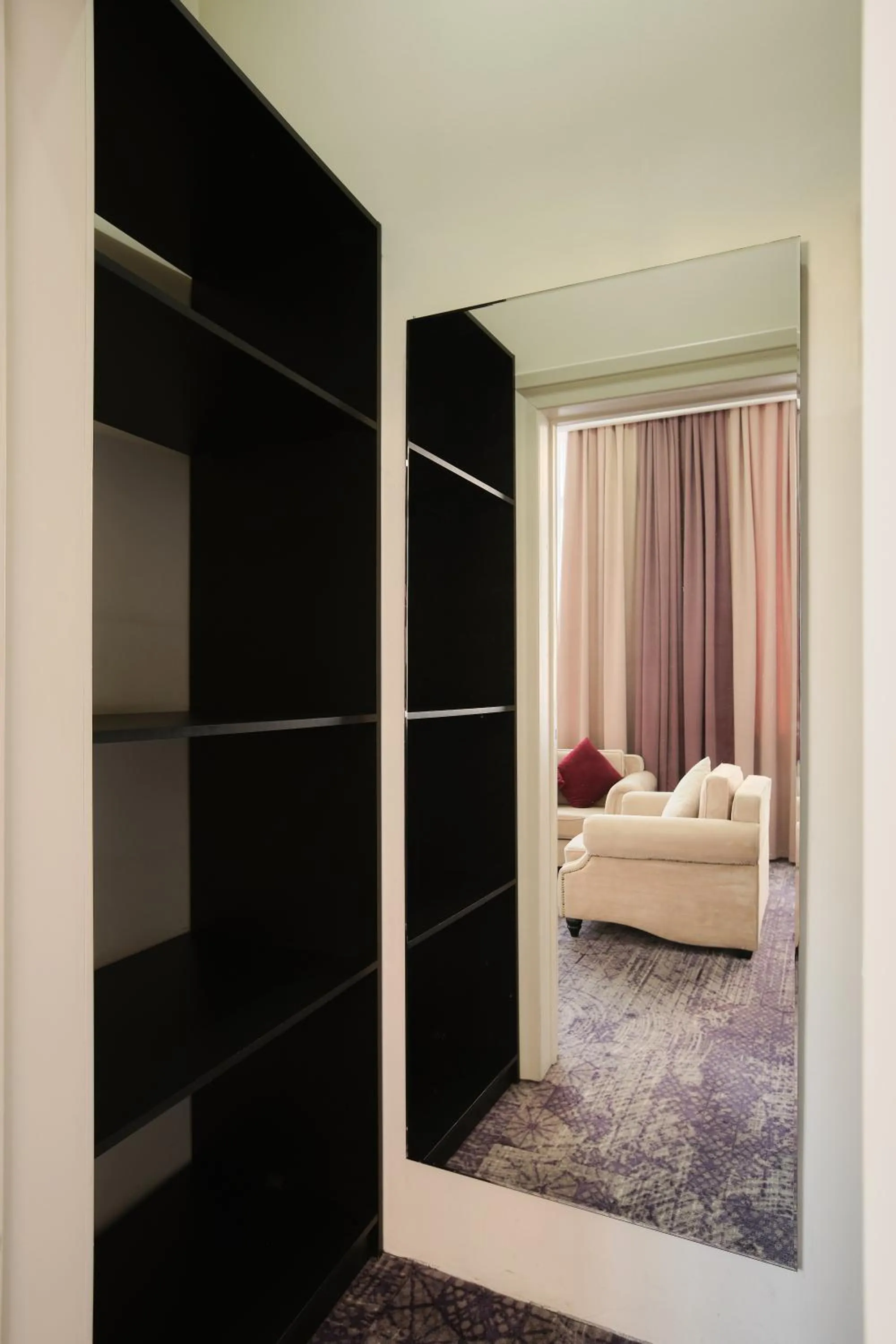 Seating area, Bed in Madison Ave Hotel Bishkek