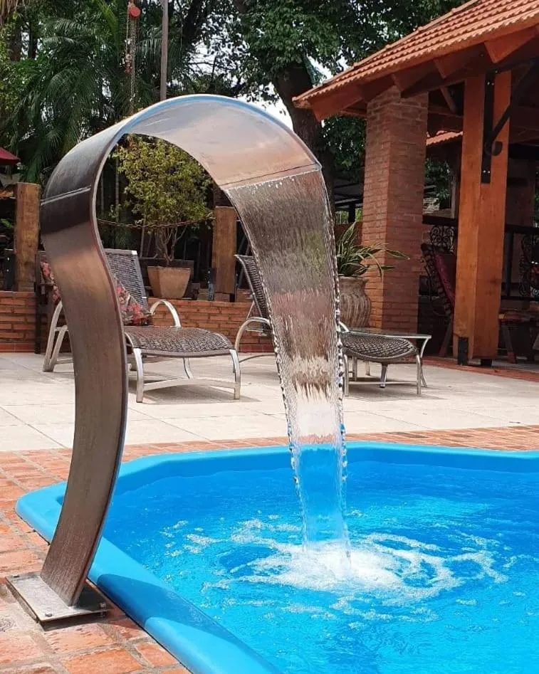 Swimming pool in Pousada Sonho Meu Foz