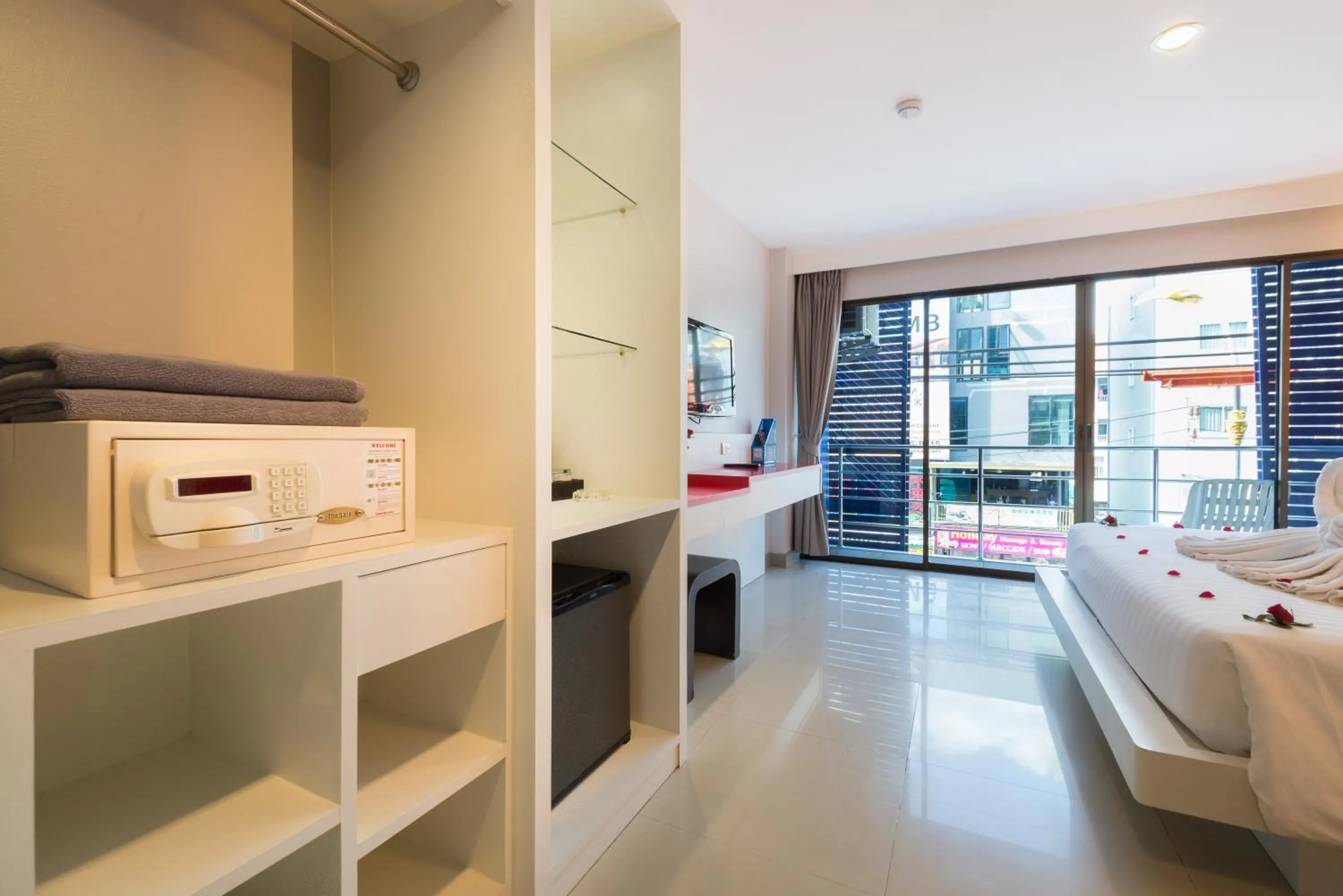 Bed in Alfresco Phuket Hotel