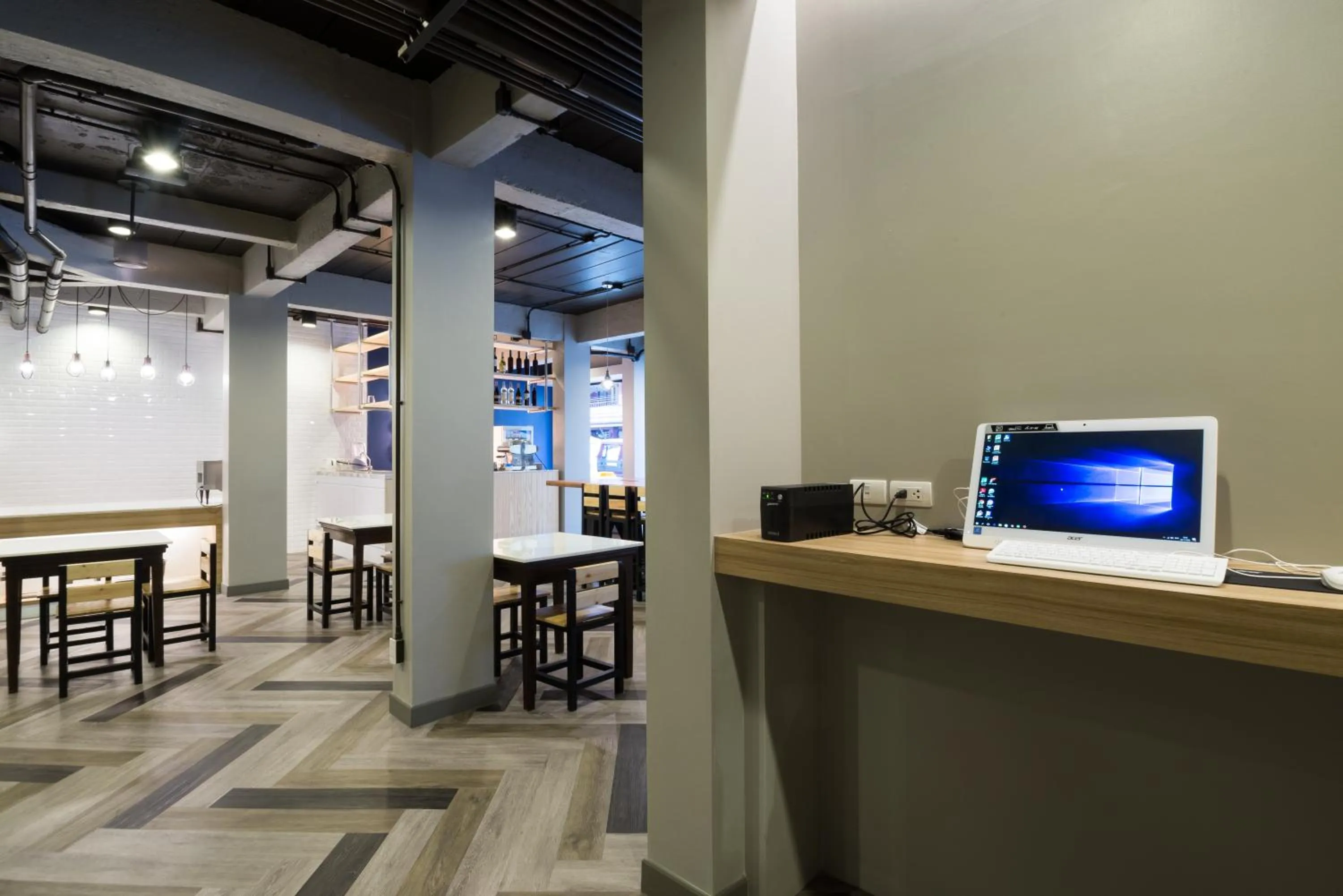 Communal lounge/ TV room in Alfresco Phuket Hotel