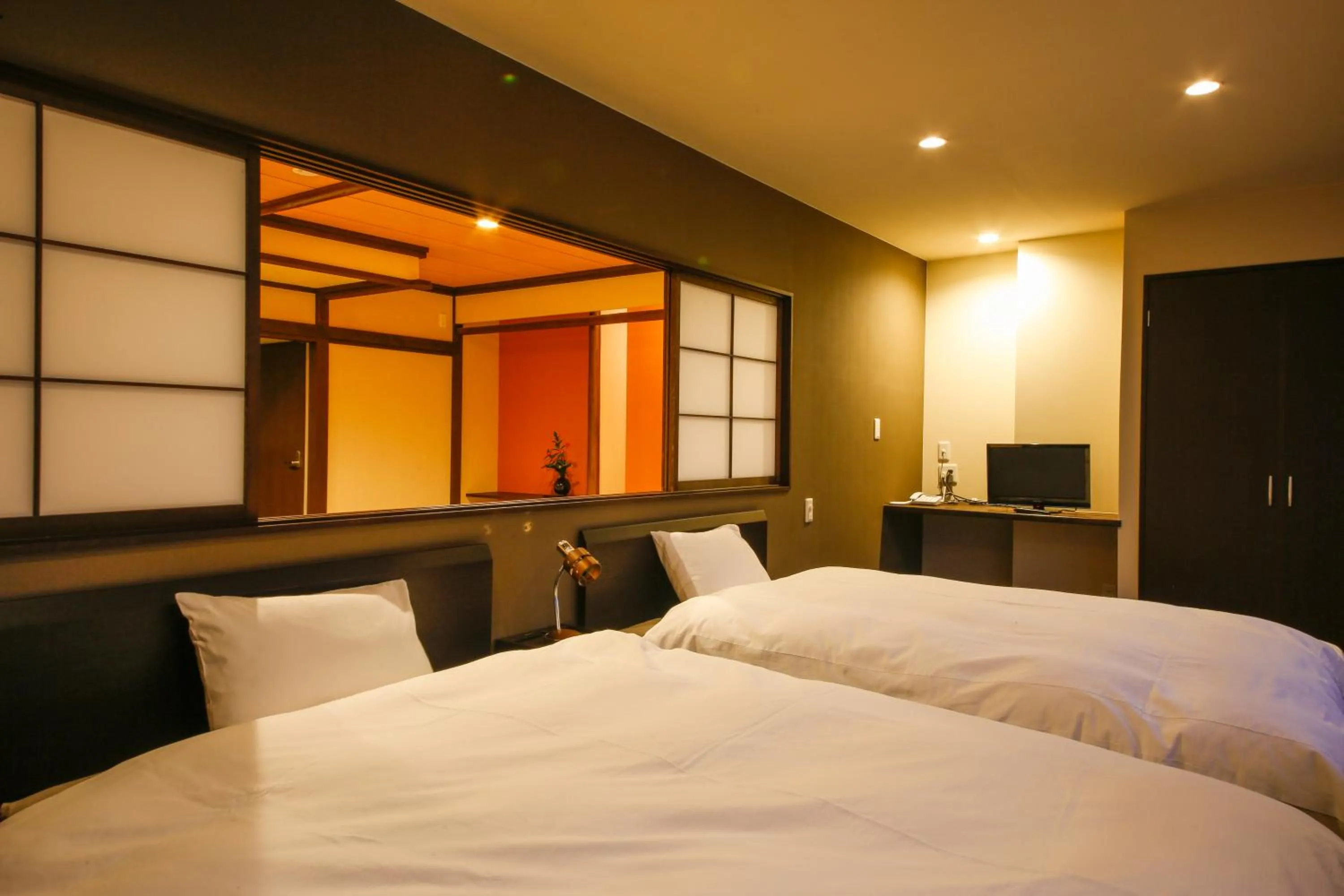 Bed in Hokuriku Yamashiro Onsen Hotel Kikyou