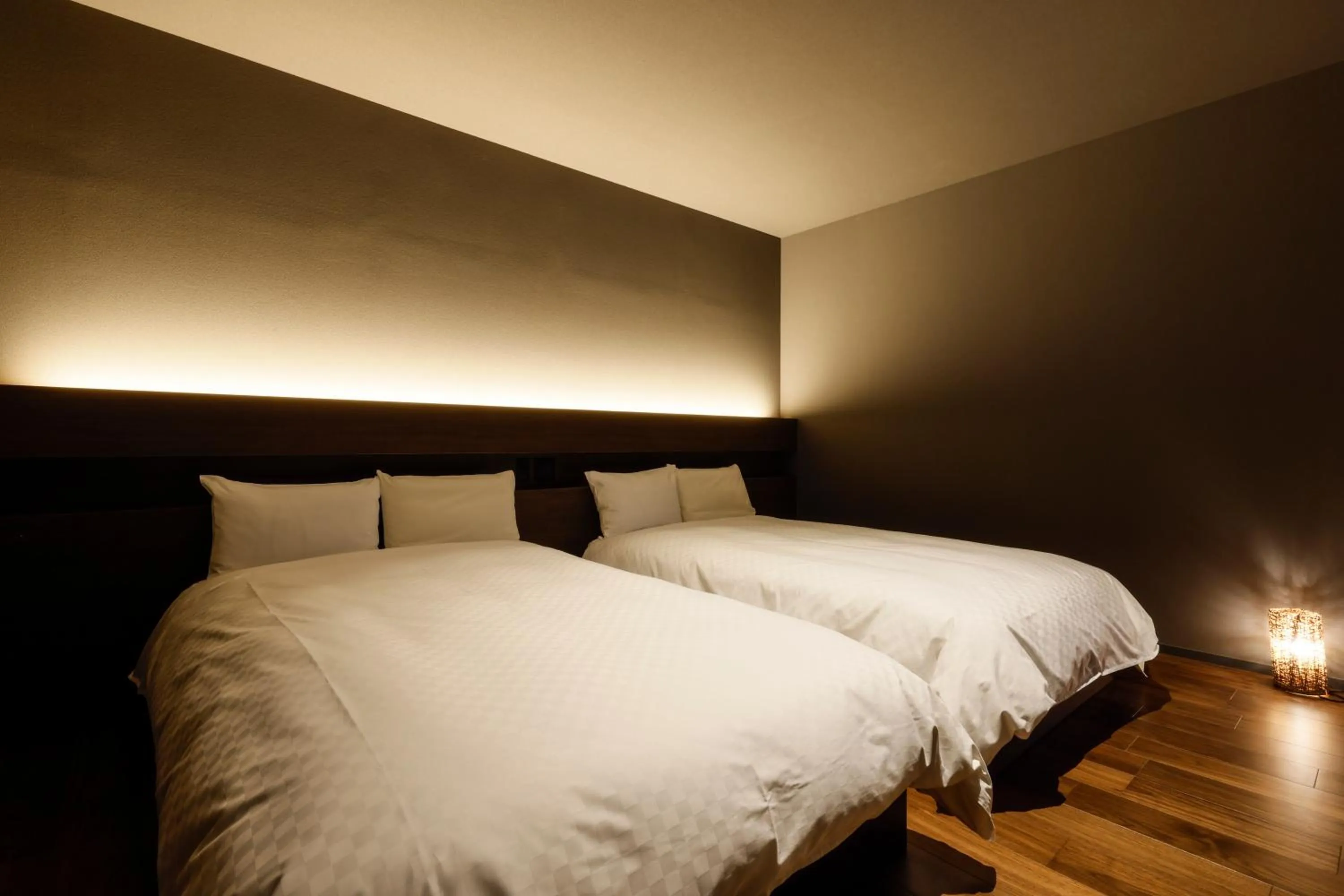 Bed in Hokuriku Yamashiro Onsen Hotel Kikyou