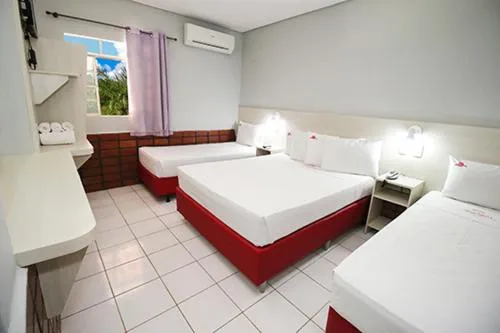 Bed in Hotel Pousada Bonsai