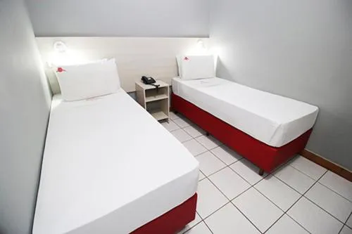 Bed in Hotel Pousada Bonsai