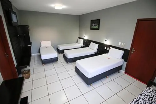 Bed in Hotel Pousada Bonsai