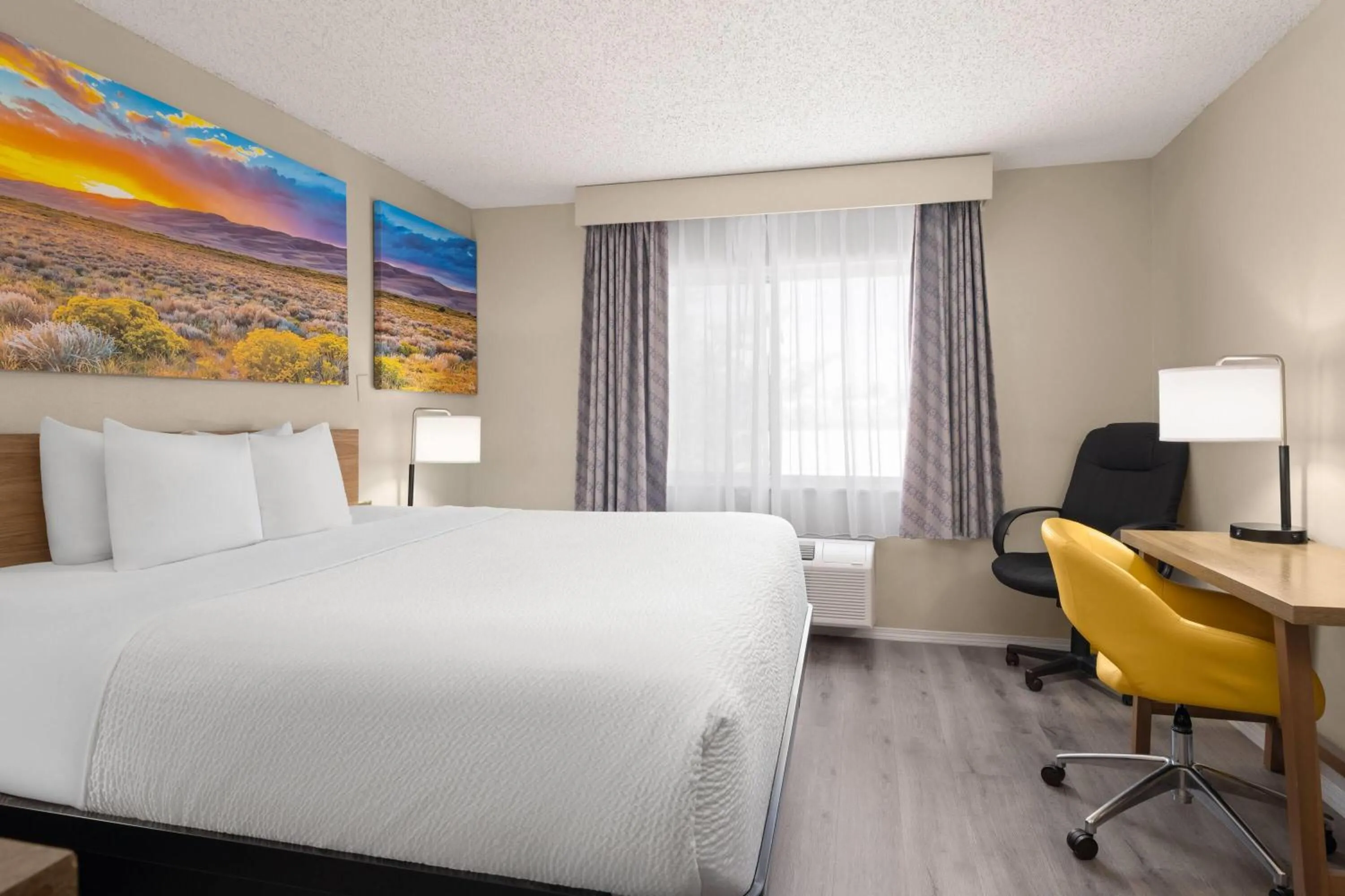 Photo of the whole room, Bed in Days Inn & Suites by Wyndham Airport Albuquerque