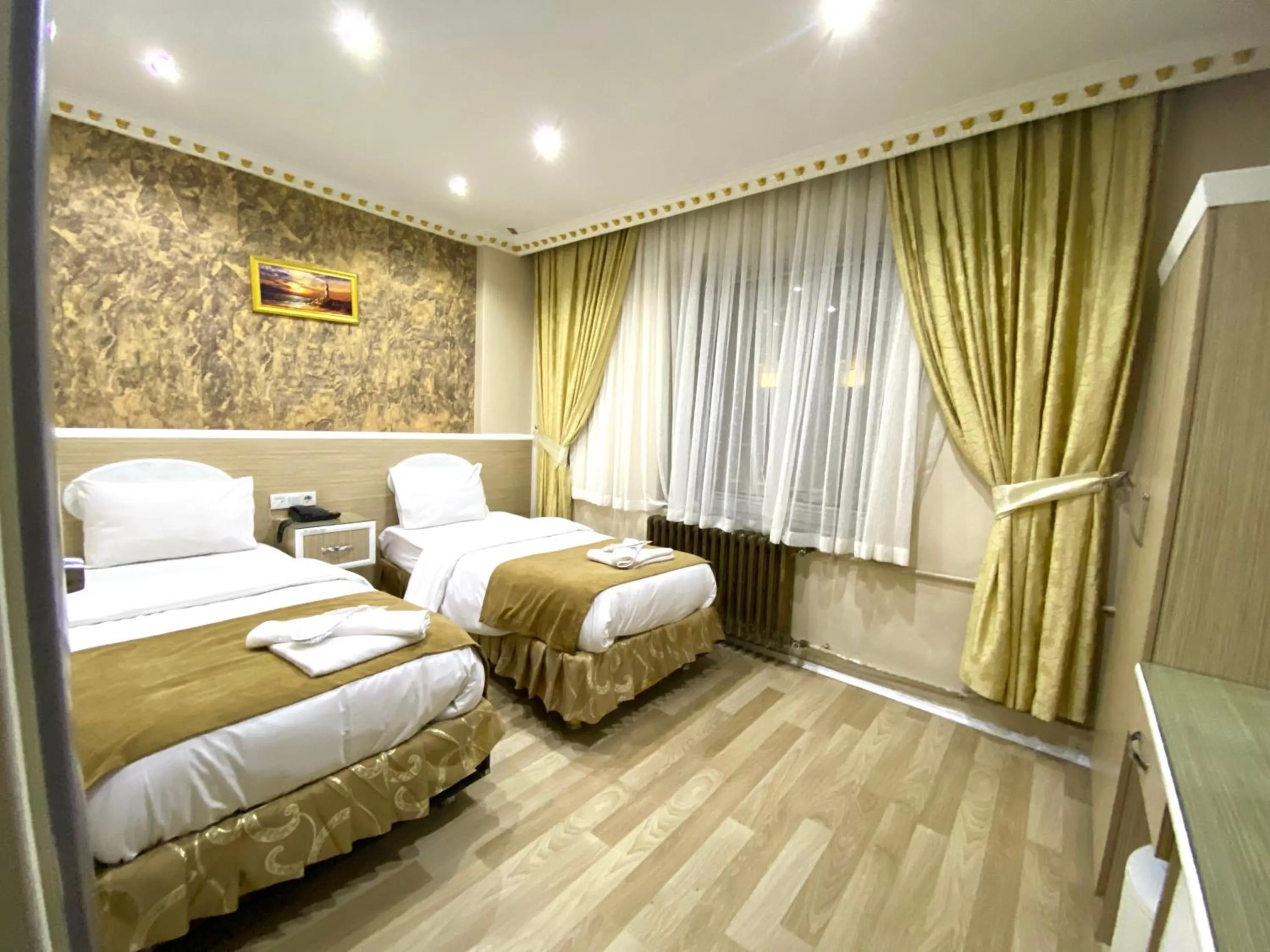 Bed in Grand Oral Hotel