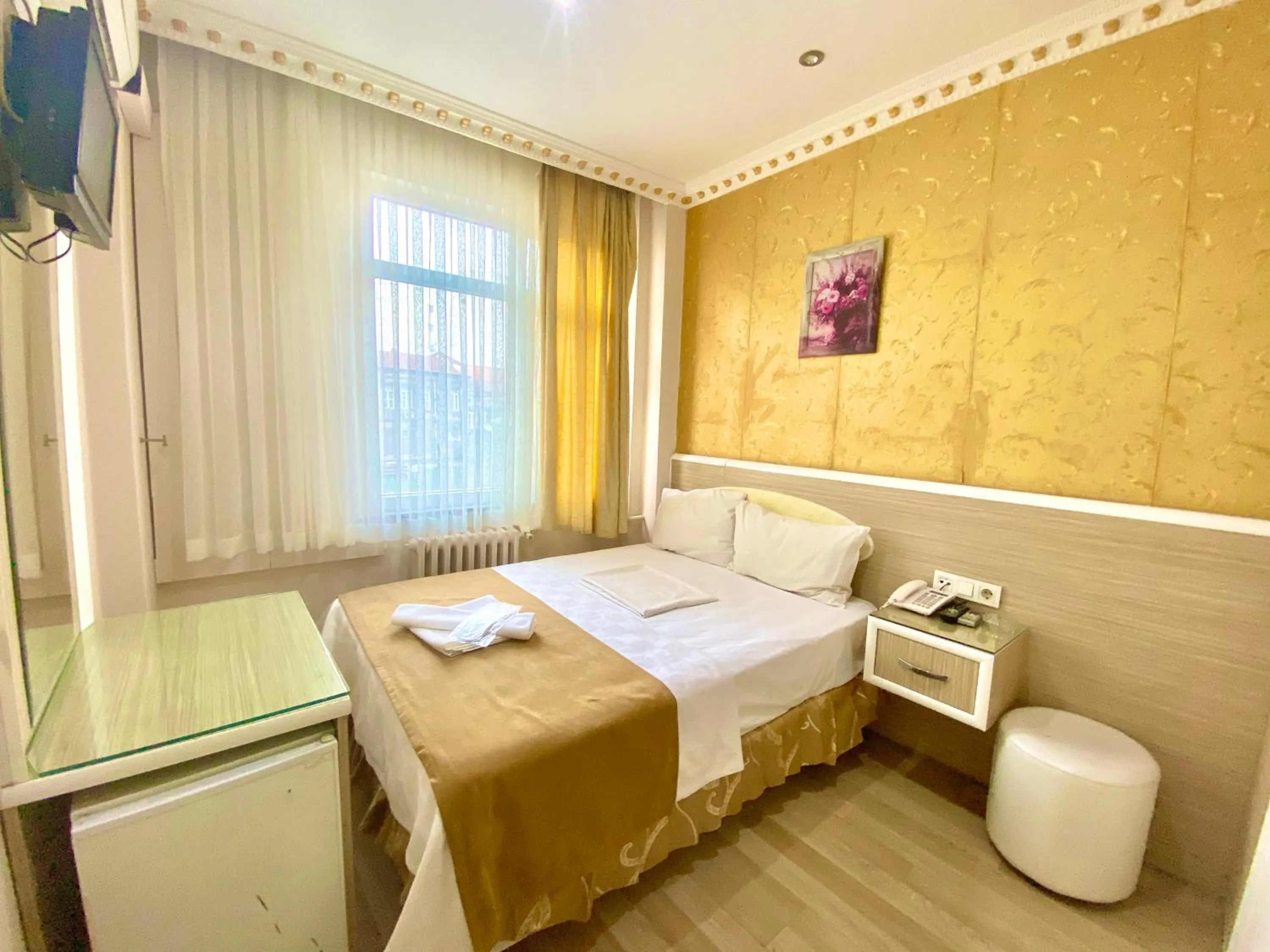 Bed in Grand Oral Hotel