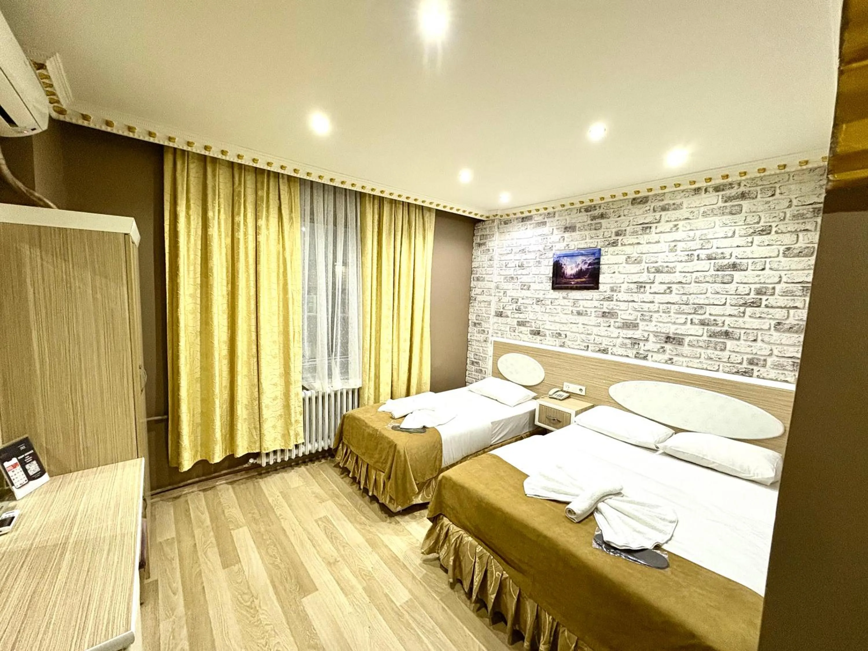 Bed in Grand Oral Hotel