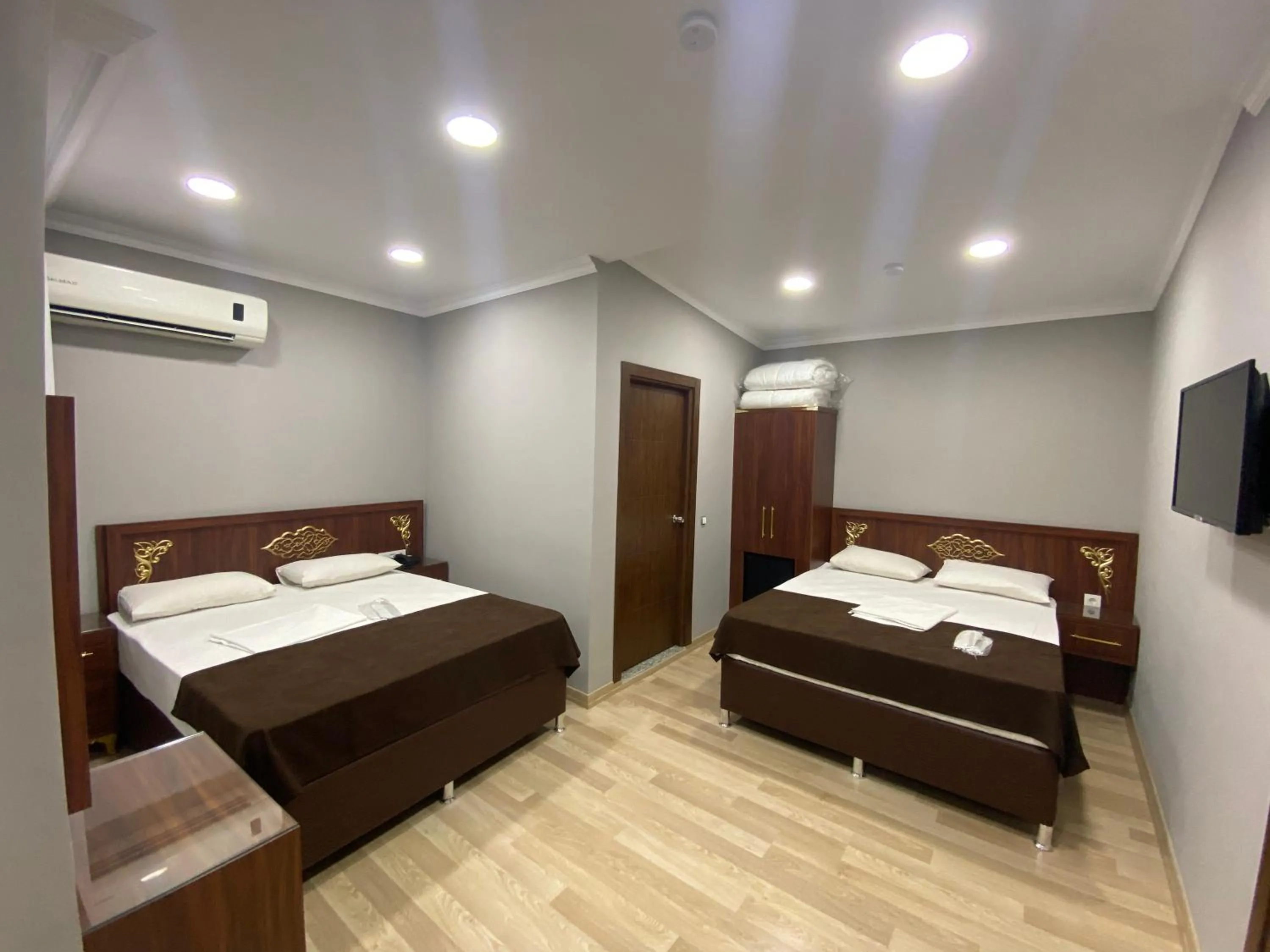 Bed in Grand Oral Hotel