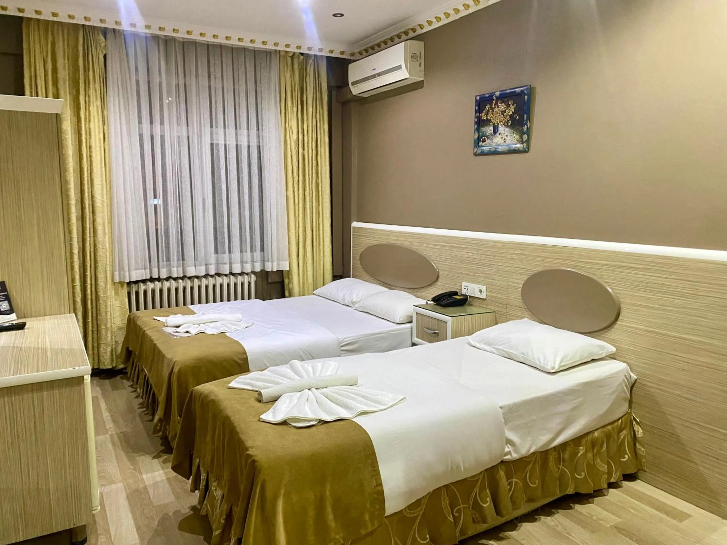 Bed in Grand Oral Hotel