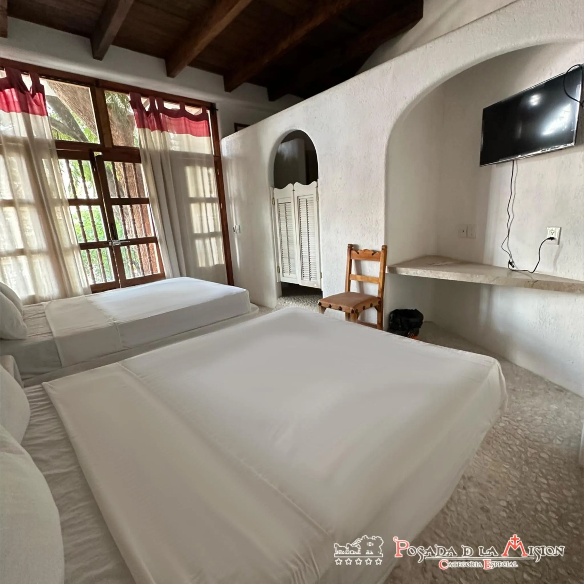 Bed in Posada de la Mision, Hotel Museo y Jardin